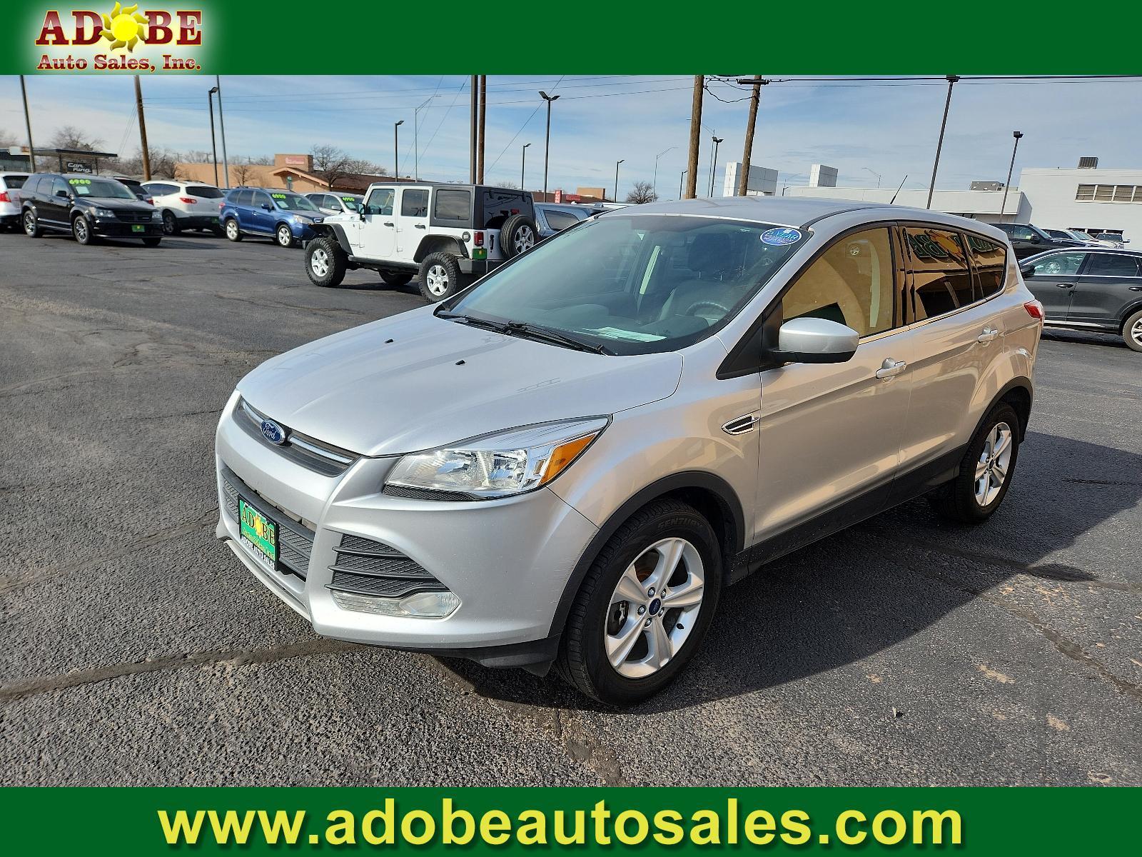 2015 Ingot Silver Metallic /Charcoal Black Ford Escape SE (1FMCU9GX2FU) with an ENGINE: 1.6L ECOBOOST engine, located at 4711 Ave Q, Lubbock, TX, 79412, (806) 687-2362, 33.551304, -101.855293 - Photo #0