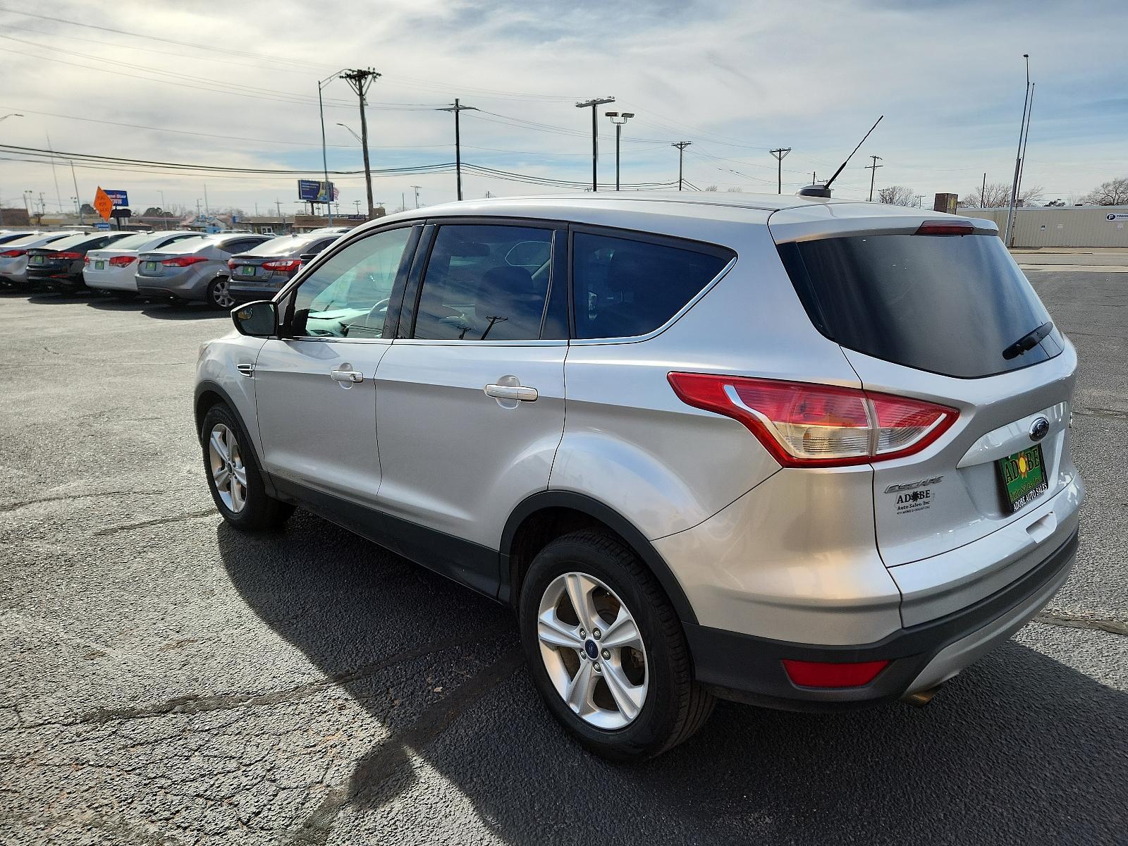 2015 Ingot Silver Metallic /Charcoal Black Ford Escape SE (1FMCU9GX2FU) with an ENGINE: 1.6L ECOBOOST engine, located at 4711 Ave Q, Lubbock, TX, 79412, (806) 687-2362, 33.551304, -101.855293 - Photo #2