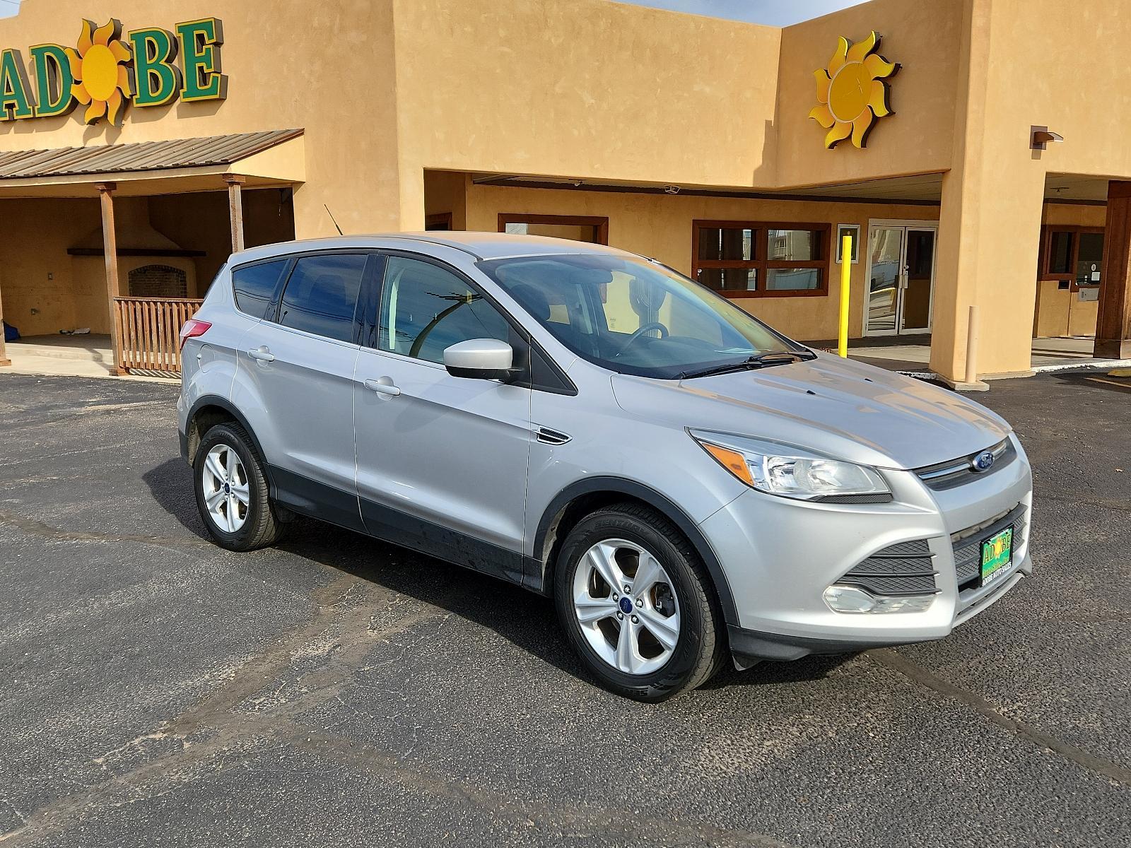 2015 Ingot Silver Metallic /Charcoal Black Ford Escape SE (1FMCU9GX2FU) with an ENGINE: 1.6L ECOBOOST engine, located at 4711 Ave Q, Lubbock, TX, 79412, (806) 687-2362, 33.551304, -101.855293 - Photo #6