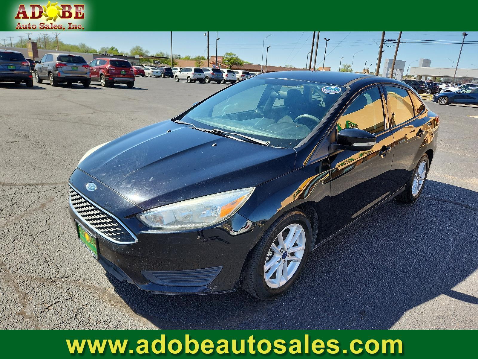 2017 Shadow Black /Charcoal Black Insert w/Warm Steel Surround, cloth Ford Focus SE (1FADP3F25HL) with an ENGINE: 2.0L I-4 GDI TI-VCT FLEX FUEL engine, located at 4711 Ave Q, Lubbock, TX, 79412, (806) 687-2362, 33.551304, -101.855293 - Photo #0