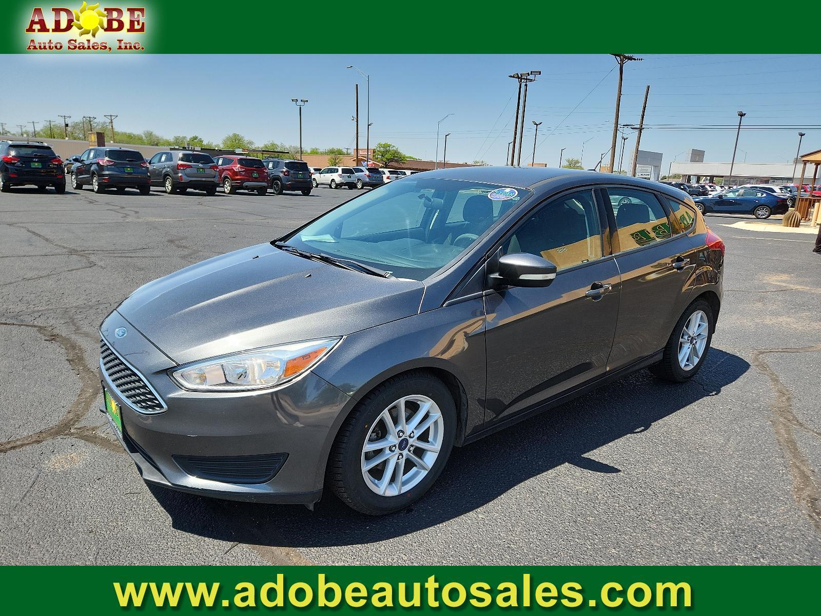2017 Magnetic Metallic /Charcoal Black Insert w/Warm Steel Surround, cloth Ford Focus SE (1FADP3K29HL) with an ENGINE: 2.0L I-4 GDI TI-VCT FLEX FUEL engine, located at 4711 Ave Q, Lubbock, TX, 79412, (806) 687-2362, 33.551304, -101.855293 - Photo #0