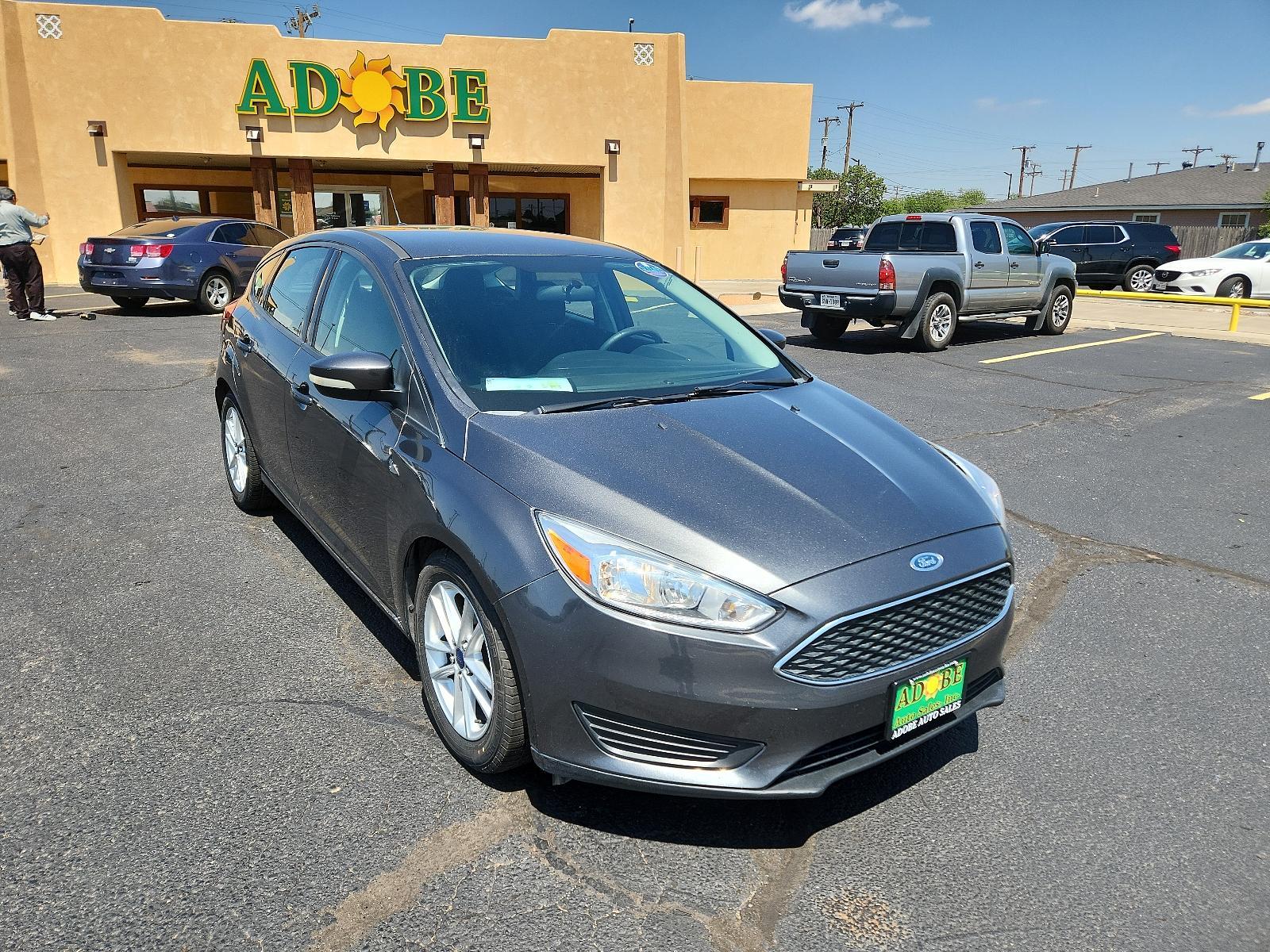 2017 Magnetic Metallic /Charcoal Black Insert w/Warm Steel Surround, cloth Ford Focus SE (1FADP3K29HL) with an ENGINE: 2.0L I-4 GDI TI-VCT FLEX FUEL engine, located at 4711 Ave Q, Lubbock, TX, 79412, (806) 687-2362, 33.551304, -101.855293 - Photo #7