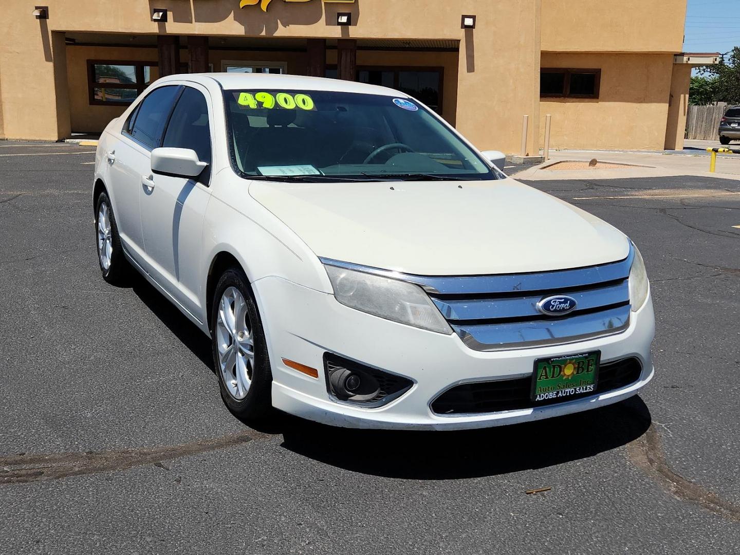 2012 White Suede /Camel Cloth Interior Ford Fusion SE (3FAHP0HA9CR) with an 2.5L 16V I4 DURATEC ENGINE engine, located at 4711 Ave Q, Lubbock, TX, 79412, (806) 687-2362, 33.551304, -101.855293 - Photo#6