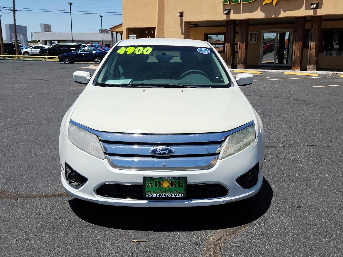 2012 White Suede /Camel Cloth Interior Ford Fusion SE (3FAHP0HA9CR) with an 2.5L 16V I4 DURATEC ENGINE engine, located at 4711 Ave Q, Lubbock, TX, 79412, (806) 687-2362, 33.551304, -101.855293 - Photo#7