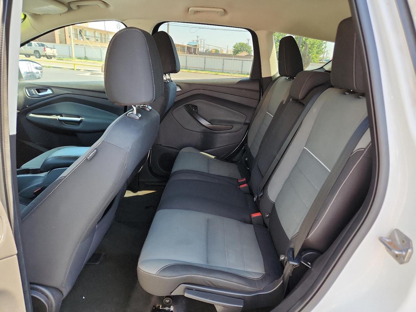 2013 Oxford White /Charcoal Black Cloth Interior Ford Escape SE (1FMCU0GX9DU) with an 1.6L I4 ECOBOOST ENGINE engine, located at 4711 Ave Q, Lubbock, TX, 79412, (806) 687-2362, 33.551304, -101.855293 - Photo#9