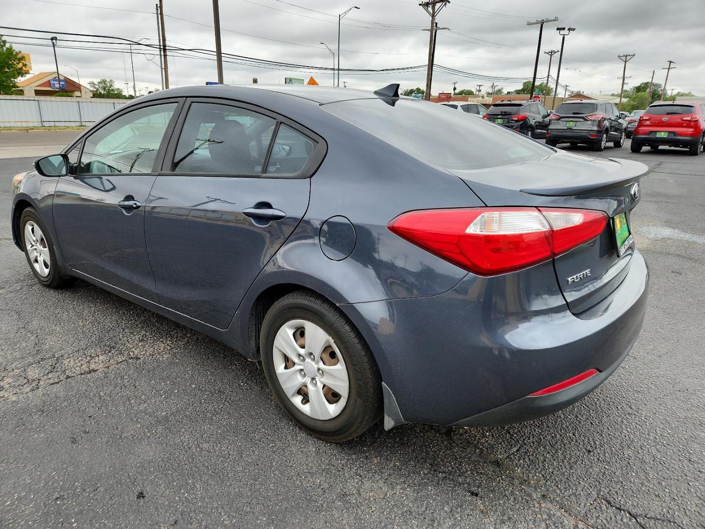 2015 Graphite Steel /Black Kia Forte LX (KNAFX4A63F5) with an Engine: 1.8L I4 DOHC D-CVVT engine, located at 4711 Ave Q, Lubbock, TX, 79412, (806) 687-2362, 33.551304, -101.855293 - Photo#2