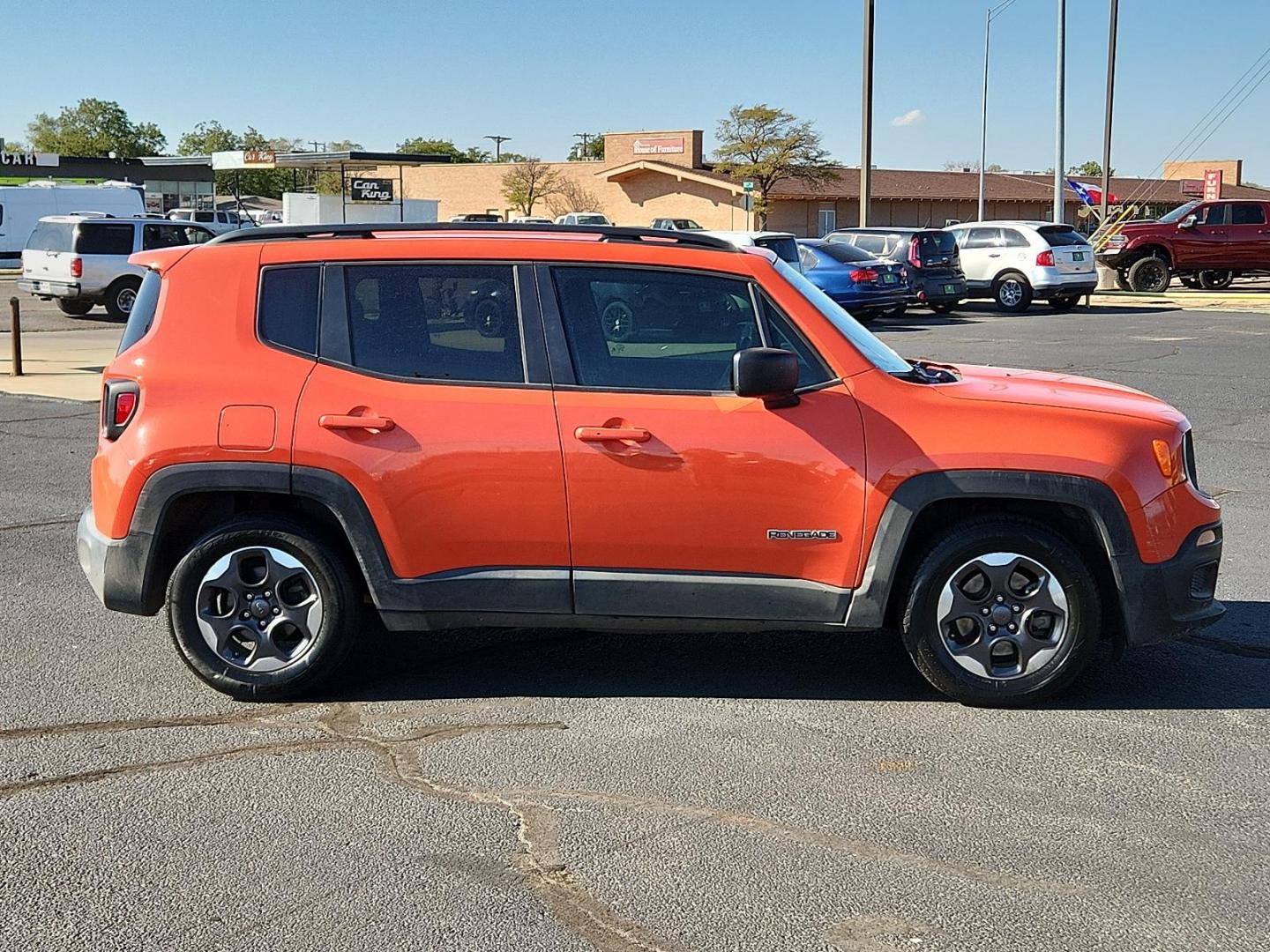 2017 Omaha Orange /Black, cloth Jeep Renegade Sport (ZACCJAABXHP) with an ENGINE: 2.4L I4 MULTIAIR engine, located at 4711 Ave Q, Lubbock, TX, 79412, (806) 687-2362, 33.551304, -101.855293 - Photo#2