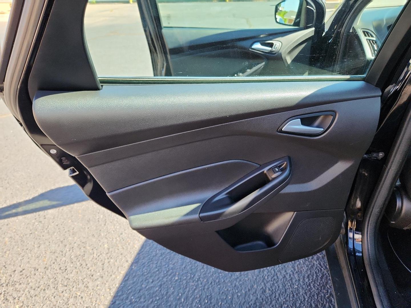 2017 Shadow Black /Charcoal Black Insert w/Warm Steel Surround, cloth Ford Focus SE (1FADP3F25HL) with an ENGINE: 2.0L I-4 GDI TI-VCT FLEX FUEL engine, located at 4711 Ave Q, Lubbock, TX, 79412, (806) 687-2362, 33.551304, -101.855293 - Photo#11