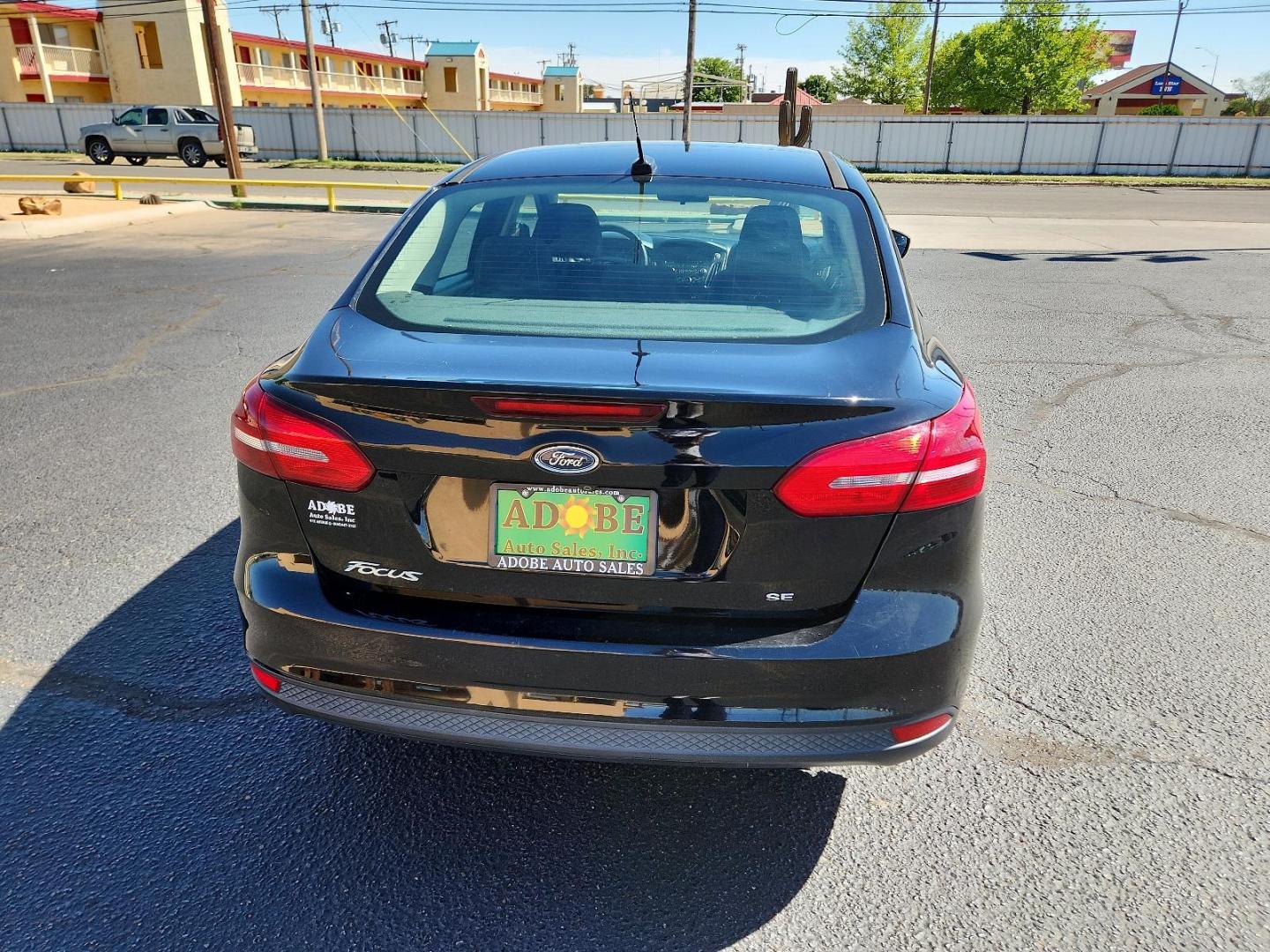 2017 Shadow Black /Charcoal Black Insert w/Warm Steel Surround, cloth Ford Focus SE (1FADP3F25HL) with an ENGINE: 2.0L I-4 GDI TI-VCT FLEX FUEL engine, located at 4711 Ave Q, Lubbock, TX, 79412, (806) 687-2362, 33.551304, -101.855293 - Photo#3