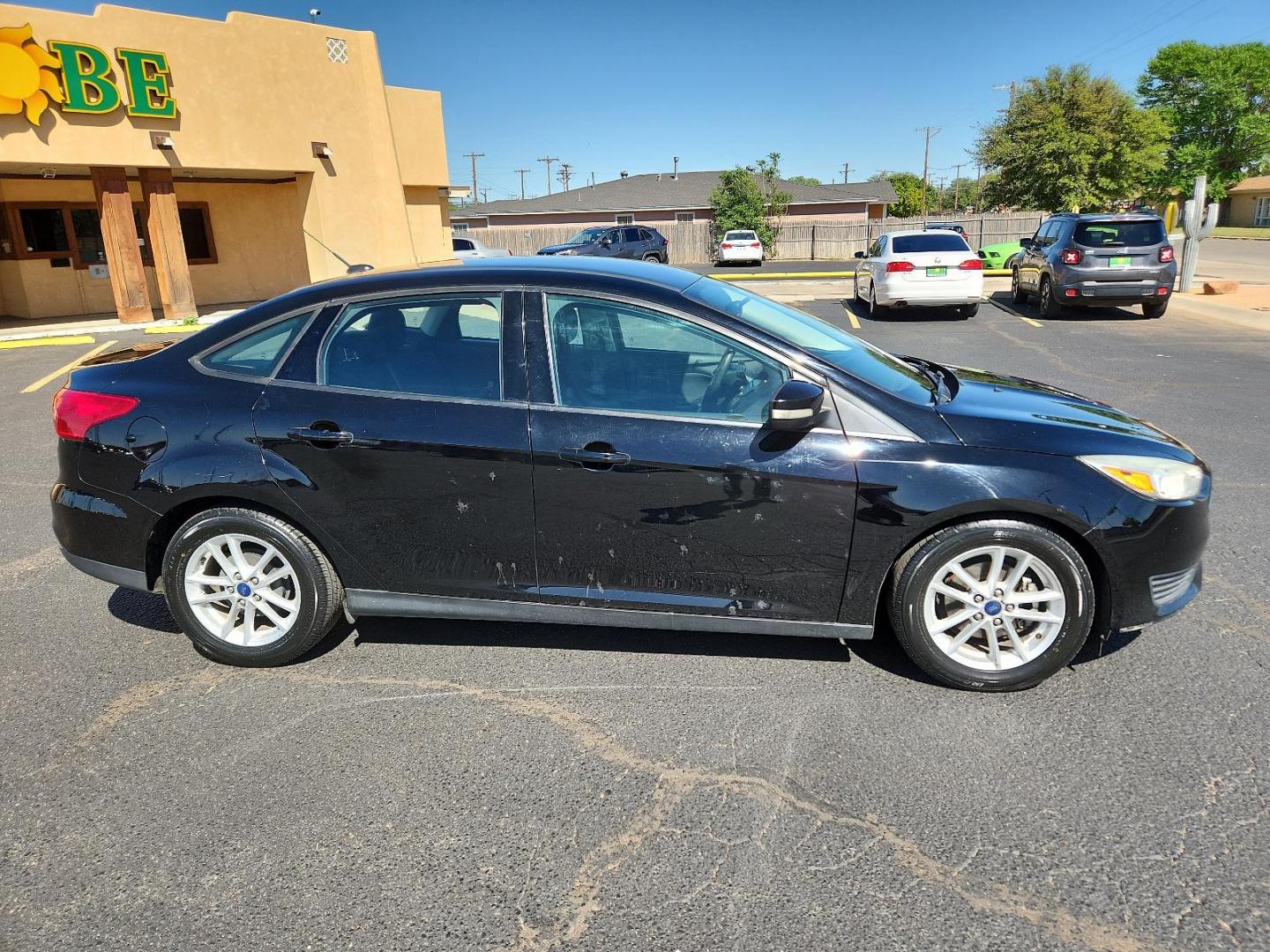 2017 Shadow Black /Charcoal Black Insert w/Warm Steel Surround, cloth Ford Focus SE (1FADP3F25HL) with an ENGINE: 2.0L I-4 GDI TI-VCT FLEX FUEL engine, located at 4711 Ave Q, Lubbock, TX, 79412, (806) 687-2362, 33.551304, -101.855293 - Photo#5