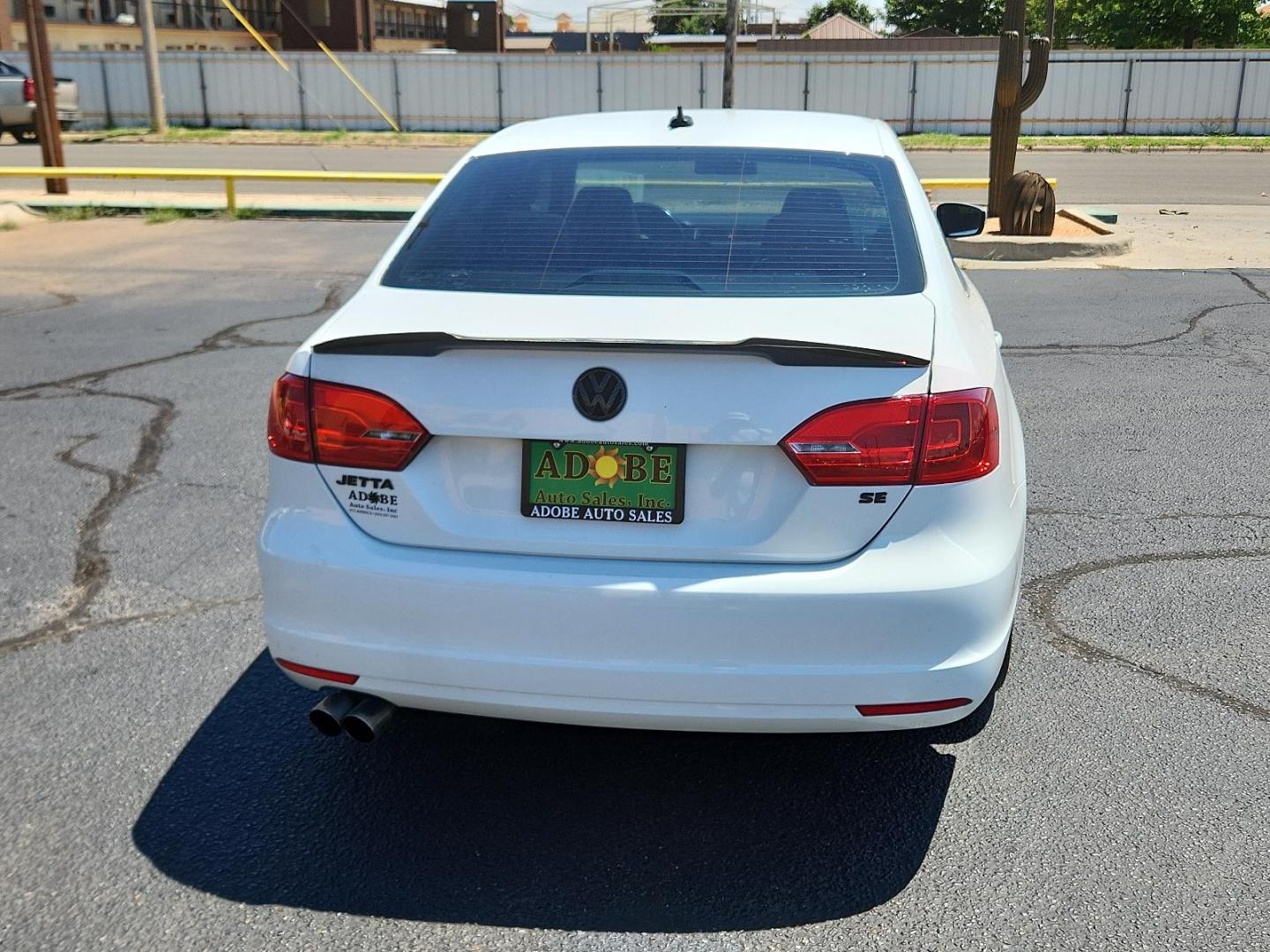 2014 Candy White /Titan Black Volkswagen Jetta Sedan SE w/Connectivity (3VWD17AJ6EM) with an Engine: 1.8L l-4 DOHC engine, located at 4711 Ave Q, Lubbock, TX, 79412, (806) 687-2362, 33.551304, -101.855293 - Photo#3