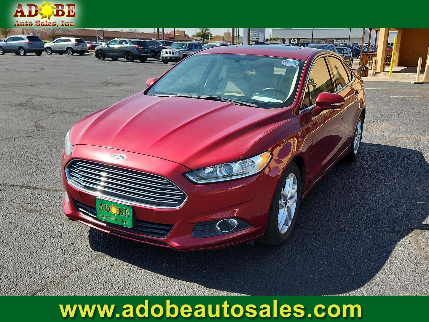 2016 Ruby Red Metallic Tinted Clearcoat /Charcoal Black, cloth Ford Fusion SE (3FA6P0HD3GR) with an ENGINE: 1.5L ECOBOOST engine, located at 4711 Ave Q, Lubbock, TX, 79412, (806) 687-2362, 33.551304, -101.855293 - Photo#0