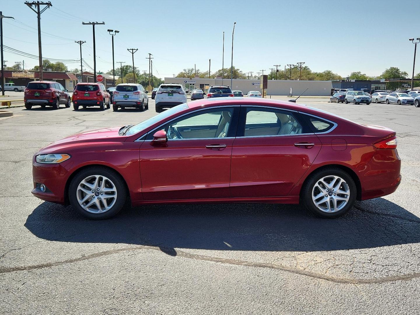 2016 Ruby Red Metallic Tinted Clearcoat /Charcoal Black, cloth Ford Fusion SE (3FA6P0HD3GR) with an ENGINE: 1.5L ECOBOOST engine, located at 4711 Ave Q, Lubbock, TX, 79412, (806) 687-2362, 33.551304, -101.855293 - Photo#1