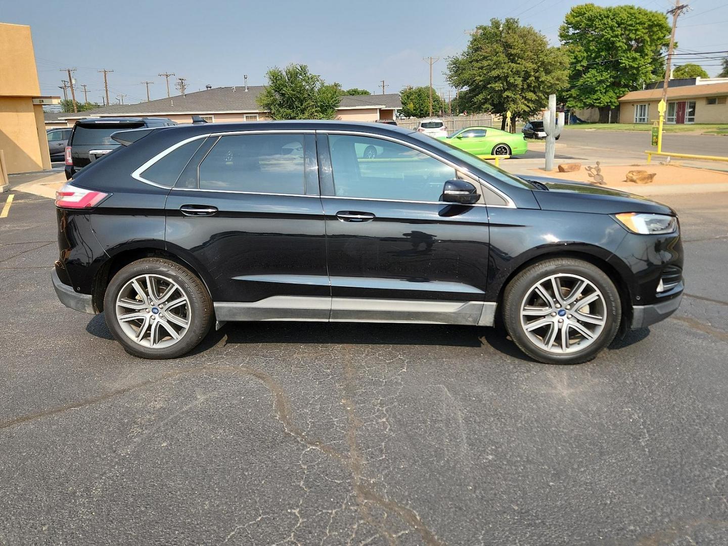 2019 Agate Black /Ceramic, premium leather Ford Edge Titanium (2FMPK3K97KB) with an ENGINE: TWIN-SCROLL 2.0L ECOBOOST engine, located at 4711 Ave Q, Lubbock, TX, 79412, (806) 687-2362, 33.551304, -101.855293 - Photo#5