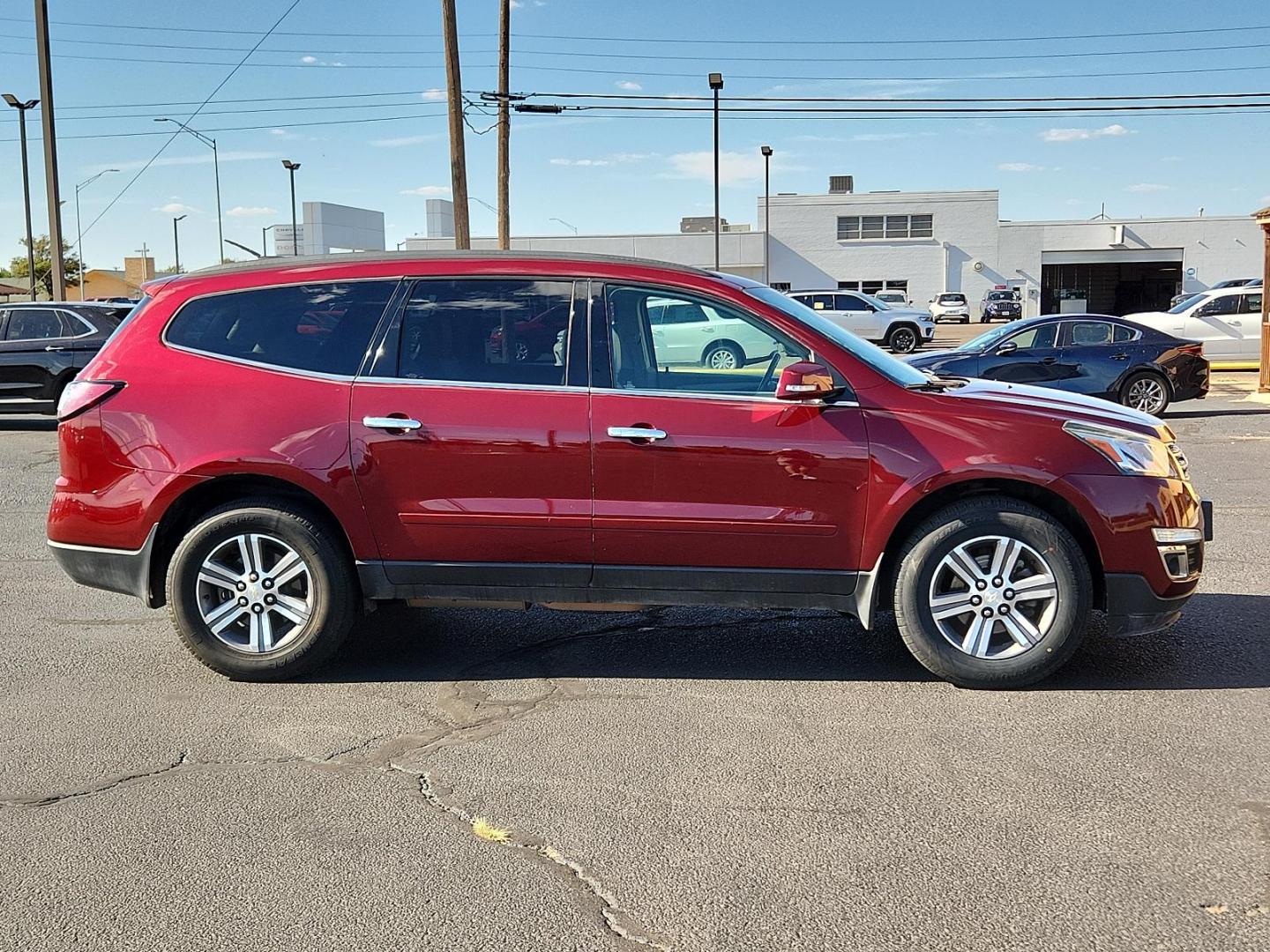 2016 Red /Gray Chevrolet Traverse LT (1GNKRHKD3GJ) with an ENGINE, 3.6L SIDI V6 engine, located at 4711 Ave Q, Lubbock, TX, 79412, (806) 687-2362, 33.551304, -101.855293 - Photo#4