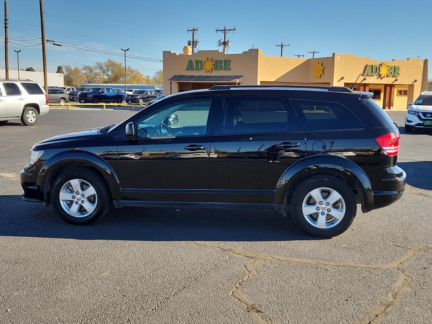 2016 Pitch Black Clear Coat Dodge Journey SE (3C4PDCAB6GT) with an ENGINE: 2.4L I4 DOHC 16V DUAL VVT engine, located at 4711 Ave Q, Lubbock, TX, 79412, (806) 687-2362, 33.551304, -101.855293 - Photo#1