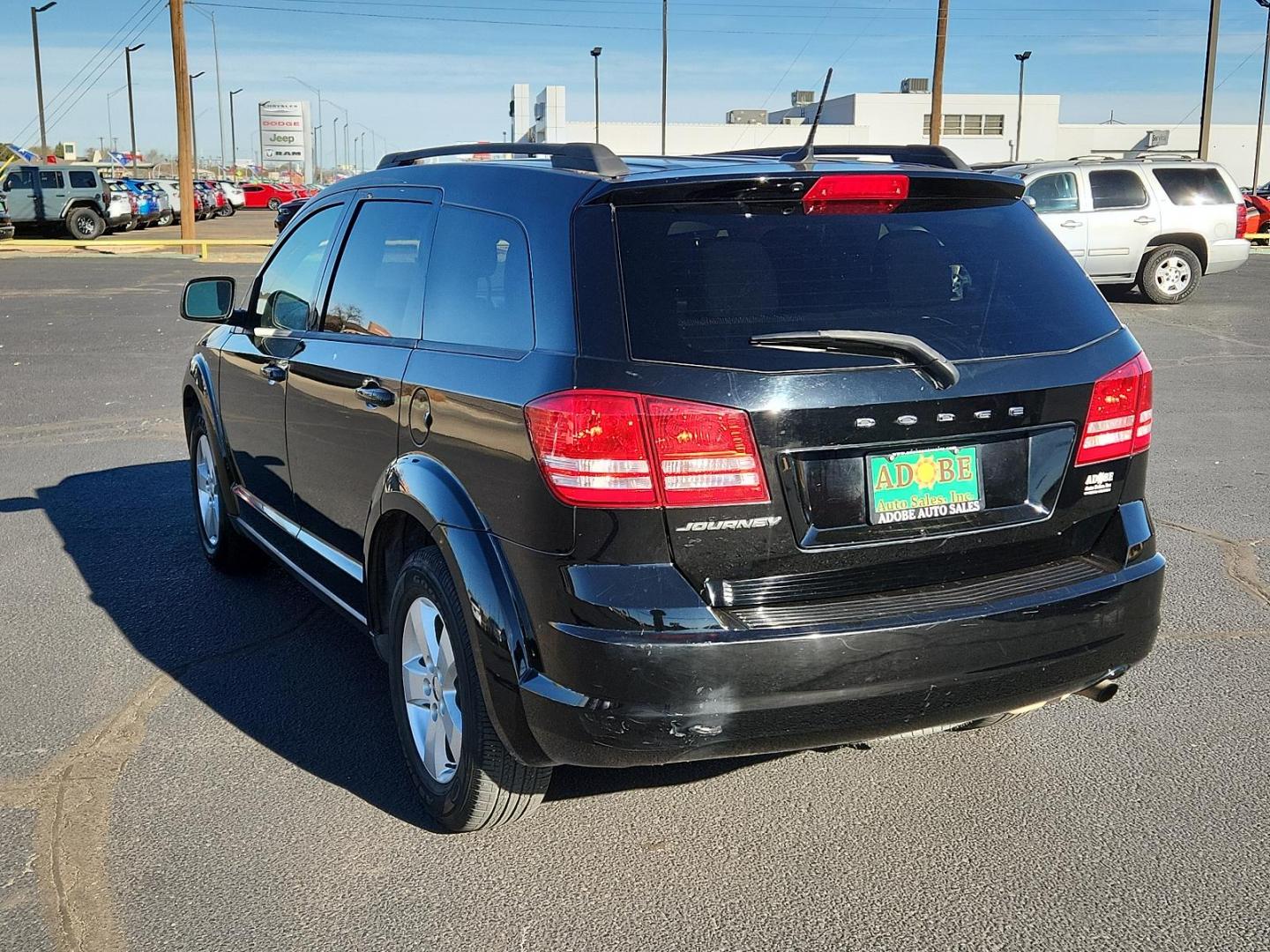 2016 Pitch Black Clear Coat Dodge Journey SE (3C4PDCAB6GT) with an ENGINE: 2.4L I4 DOHC 16V DUAL VVT engine, located at 4711 Ave Q, Lubbock, TX, 79412, (806) 687-2362, 33.551304, -101.855293 - Photo#2