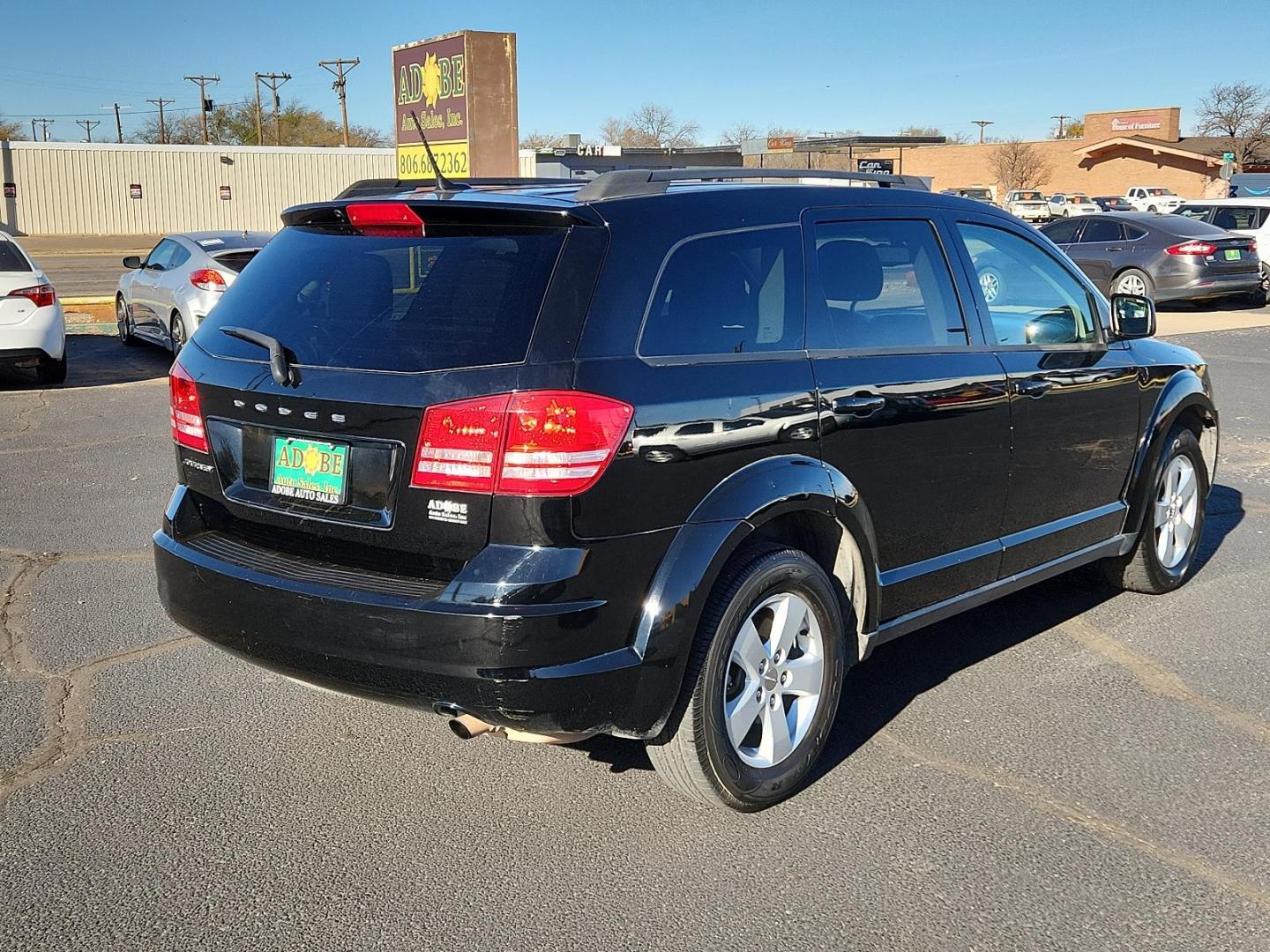 2016 Pitch Black Clear Coat Dodge Journey SE (3C4PDCAB6GT) with an ENGINE: 2.4L I4 DOHC 16V DUAL VVT engine, located at 4711 Ave Q, Lubbock, TX, 79412, (806) 687-2362, 33.551304, -101.855293 - Photo#3