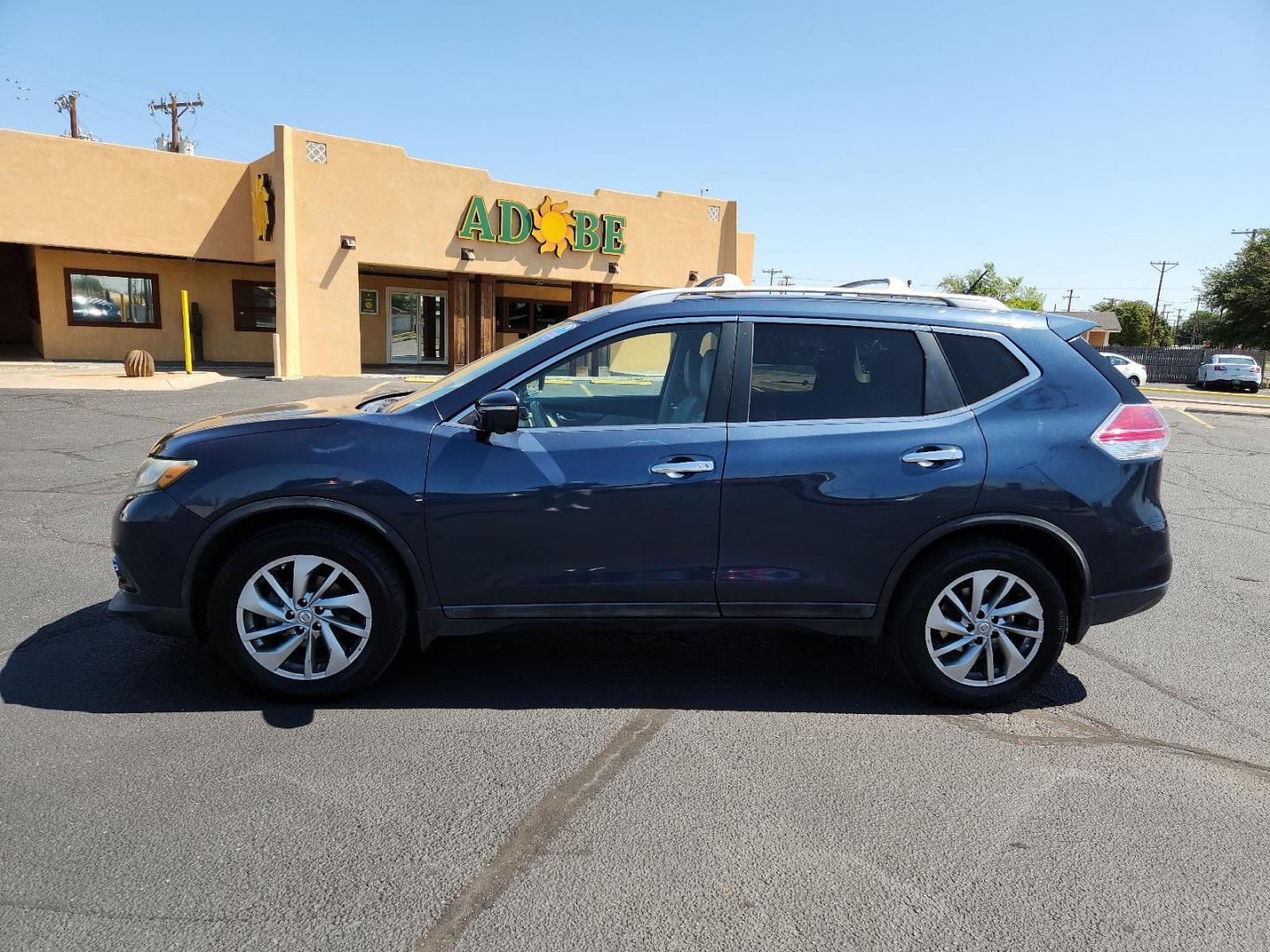 2015 Arctic Blue Metallic /Almond, leather Nissan Rogue SL (5N1AT2MT7FC) with an Engine: 2.5L DOHC 16-Valve I4 -inc: ECO mode engine, located at 4711 Ave Q, Lubbock, TX, 79412, (806) 687-2362, 33.551304, -101.855293 - Photo#1