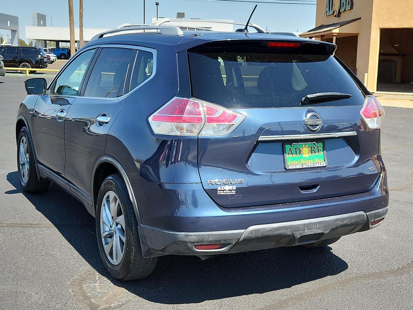 2015 Arctic Blue Metallic /Almond, leather Nissan Rogue SL (5N1AT2MT7FC) with an Engine: 2.5L DOHC 16-Valve I4 -inc: ECO mode engine, located at 4711 Ave Q, Lubbock, TX, 79412, (806) 687-2362, 33.551304, -101.855293 - Photo#2