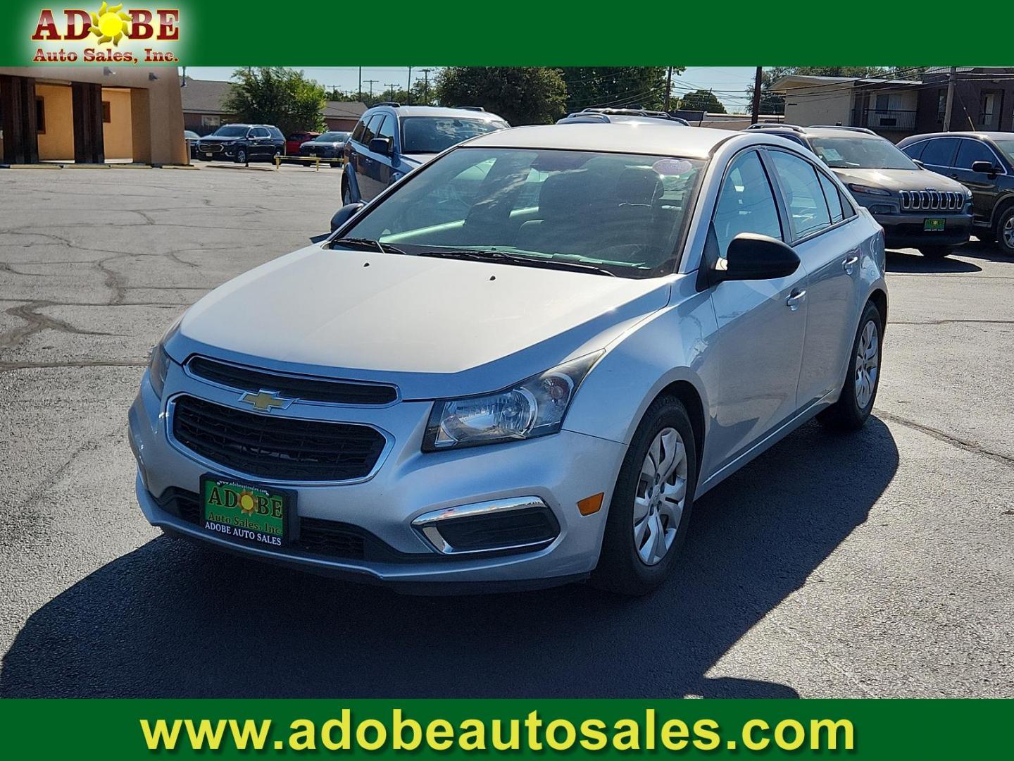 2015 Silver Ice Metallic /Jet Black/Medium Titanium, premium cloth Chevrolet Cruze LS (1G1PA5SG4F7) with an ENGINE, ECOTEC 1.8L VARIABLE VALVE TIMING DOHC 4-CYLINDER SEQUENTIAL MFI engine, located at 4711 Ave Q, Lubbock, TX, 79412, (806) 687-2362, 33.551304, -101.855293 - Photo#0