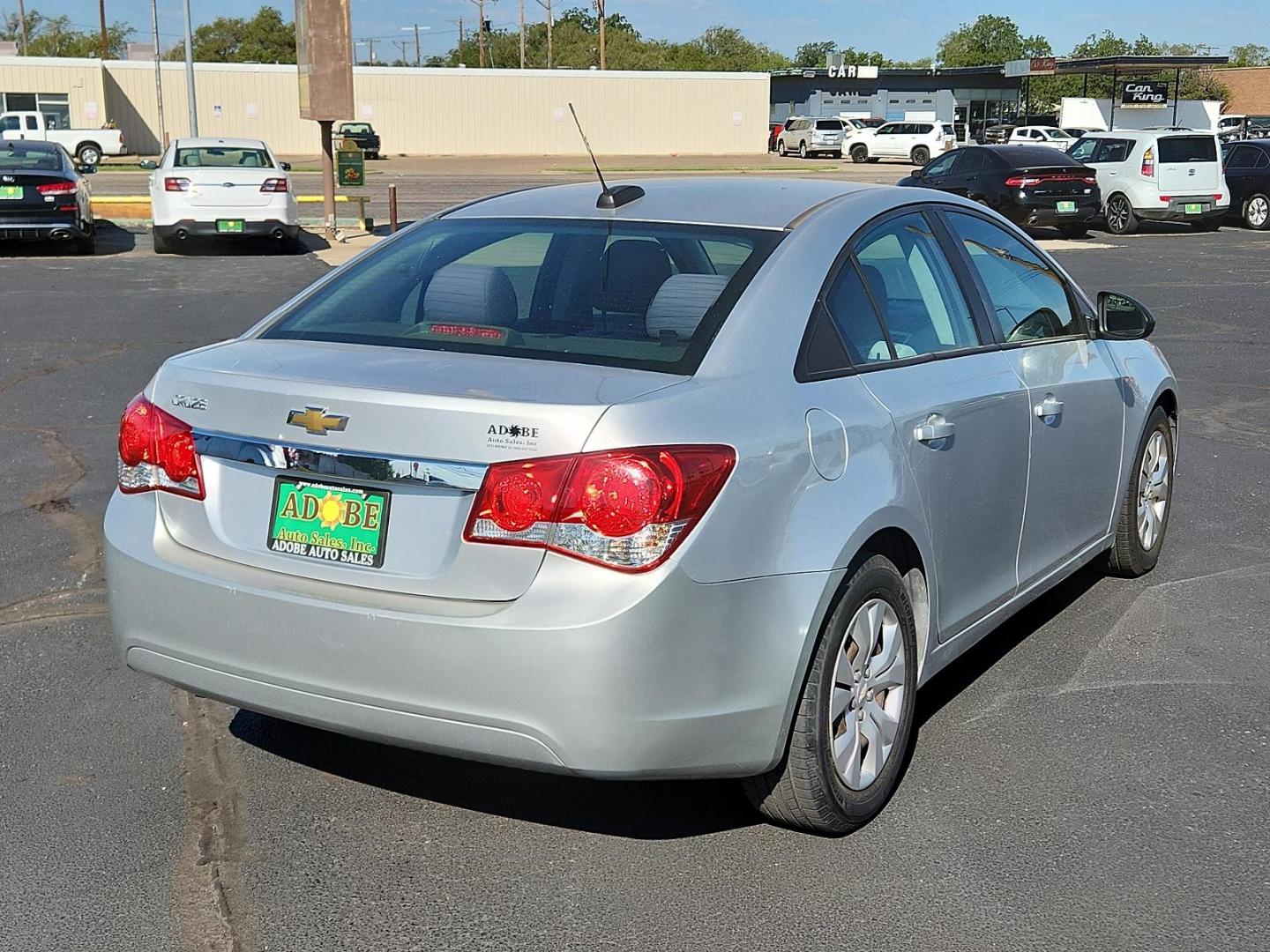 2015 Silver Ice Metallic /Jet Black/Medium Titanium, premium cloth Chevrolet Cruze LS (1G1PA5SG4F7) with an ENGINE, ECOTEC 1.8L VARIABLE VALVE TIMING DOHC 4-CYLINDER SEQUENTIAL MFI engine, located at 4711 Ave Q, Lubbock, TX, 79412, (806) 687-2362, 33.551304, -101.855293 - Photo#3