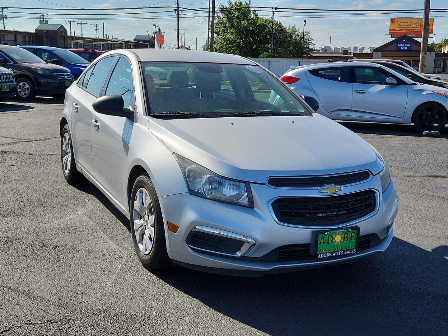 2015 Silver Ice Metallic /Jet Black/Medium Titanium, premium cloth Chevrolet Cruze LS (1G1PA5SG4F7) with an ENGINE, ECOTEC 1.8L VARIABLE VALVE TIMING DOHC 4-CYLINDER SEQUENTIAL MFI engine, located at 4711 Ave Q, Lubbock, TX, 79412, (806) 687-2362, 33.551304, -101.855293 - Photo#5