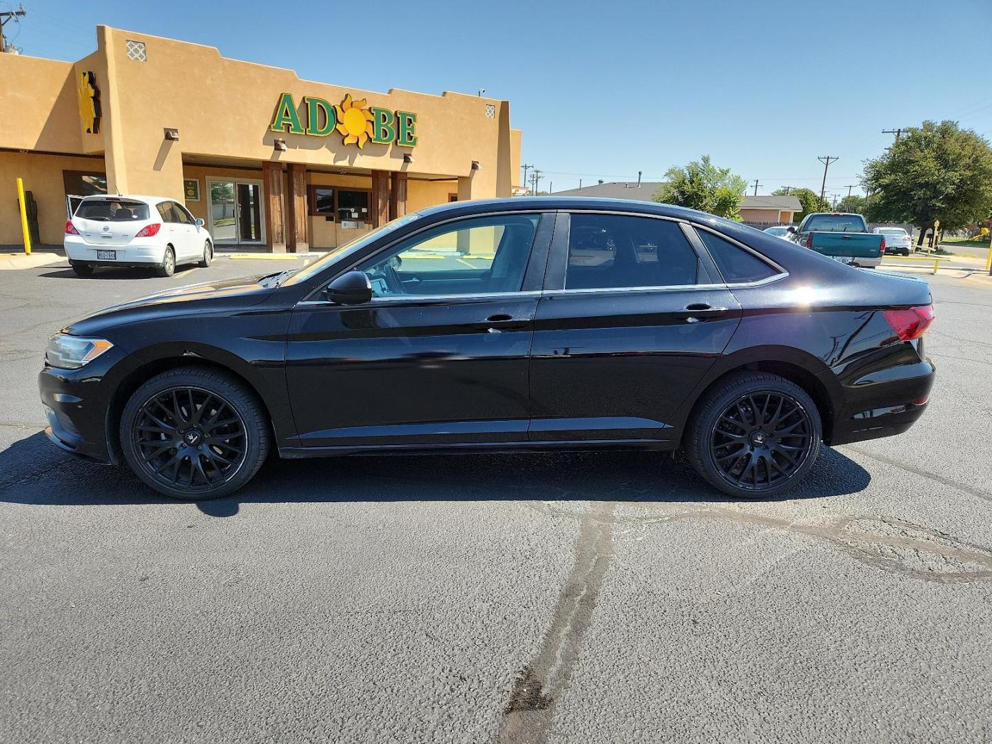 2019 Black Uni /Titan Black, cloth Volkswagen Jetta SE (3VWC57BU8KM) with an Engine: 1.4L TSI I-4 Turbocharged -inc: DOHC 16-valve, direct fuel injection engine, located at 4711 Ave Q, Lubbock, TX, 79412, (806) 687-2362, 33.551304, -101.855293 - Photo#1