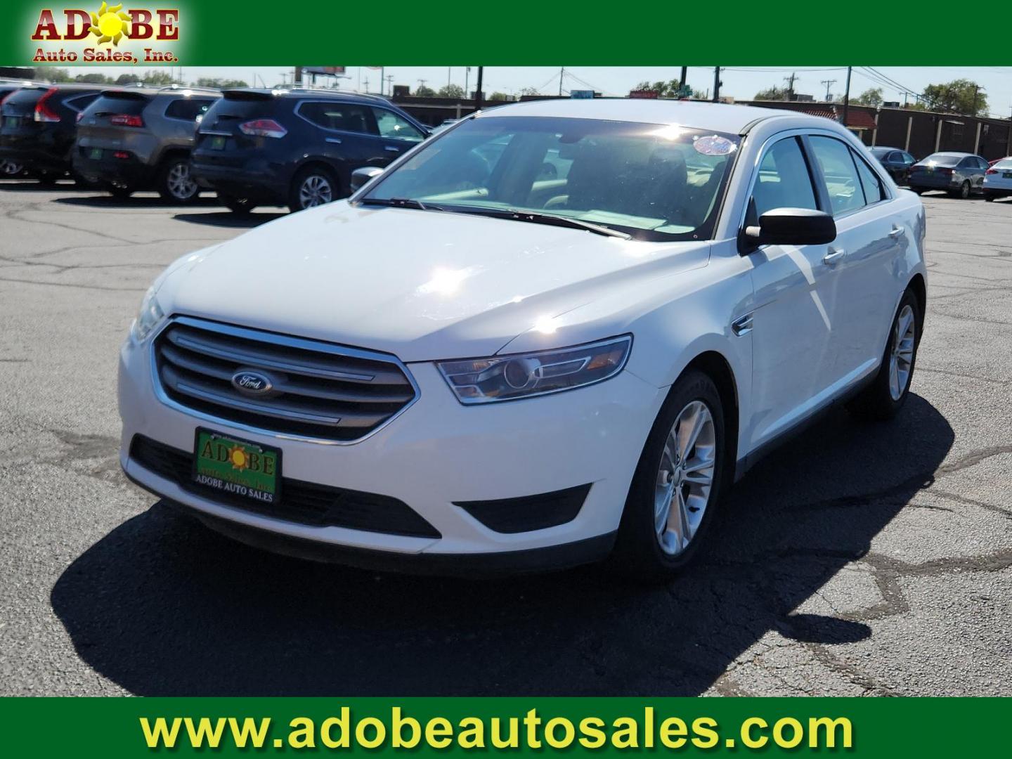 2016 Oxford White /Dune, cloth Ford Taurus SE (1FAHP2D83GG) with an ENGINE: 3.5L TI-VCT V6 (FFV) engine, located at 4711 Ave Q, Lubbock, TX, 79412, (806) 687-2362, 33.551304, -101.855293 - Photo#0