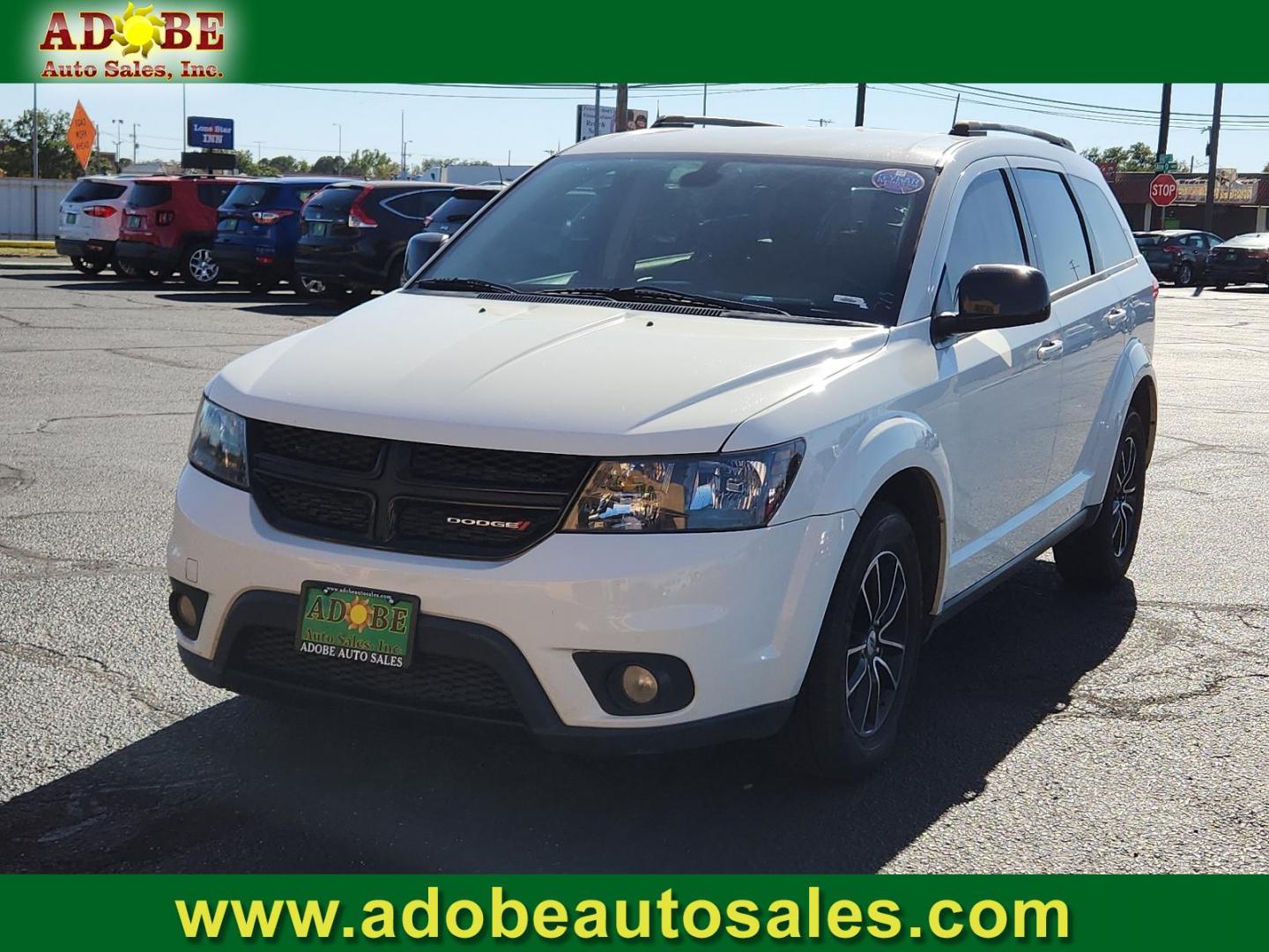 2019 Vice White /Black, premium cloth Dodge Journey SE (3C4PDCBB4KT) with an ENGINE: 2.4L I4 DOHC 16V DUAL VVT engine, located at 4711 Ave Q, Lubbock, TX, 79412, (806) 687-2362, 33.551304, -101.855293 - Photo#0