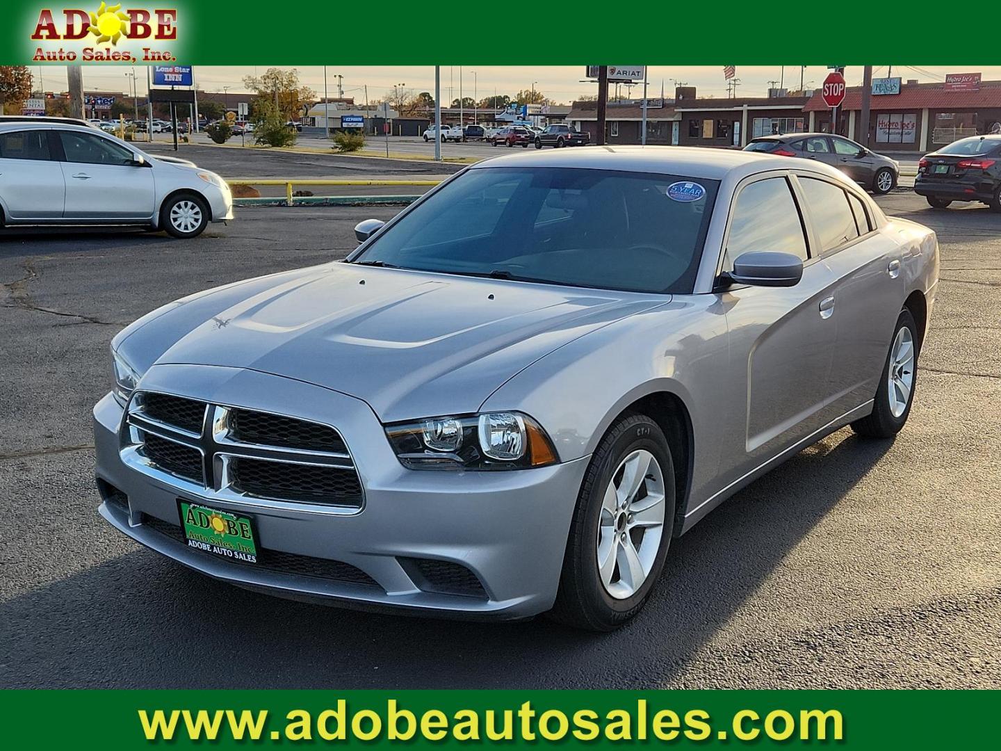 2014 Billet Silver Metallic CC Dodge Charger SE (2C3CDXBG1EH) with an ENGINE: 3.6L V6 24V VVT engine, located at 4711 Ave Q, Lubbock, TX, 79412, (806) 687-2362, 33.551304, -101.855293 - Photo#0