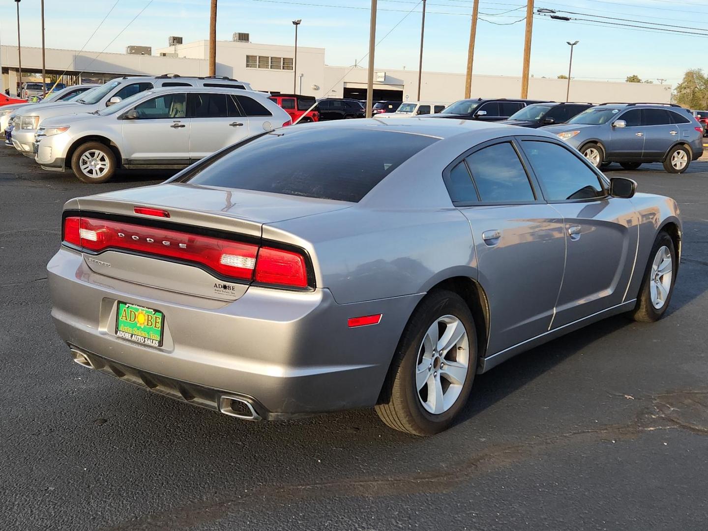 2014 Billet Silver Metallic CC Dodge Charger SE (2C3CDXBG1EH) with an ENGINE: 3.6L V6 24V VVT engine, located at 4711 Ave Q, Lubbock, TX, 79412, (806) 687-2362, 33.551304, -101.855293 - Photo#2