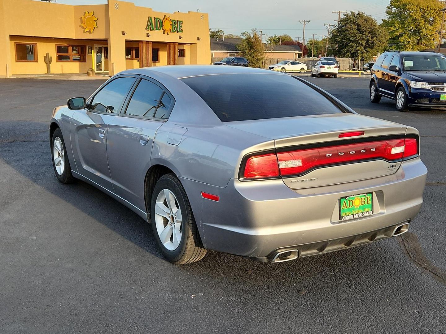 2014 Billet Silver Metallic CC Dodge Charger SE (2C3CDXBG1EH) with an ENGINE: 3.6L V6 24V VVT engine, located at 4711 Ave Q, Lubbock, TX, 79412, (806) 687-2362, 33.551304, -101.855293 - Photo#3