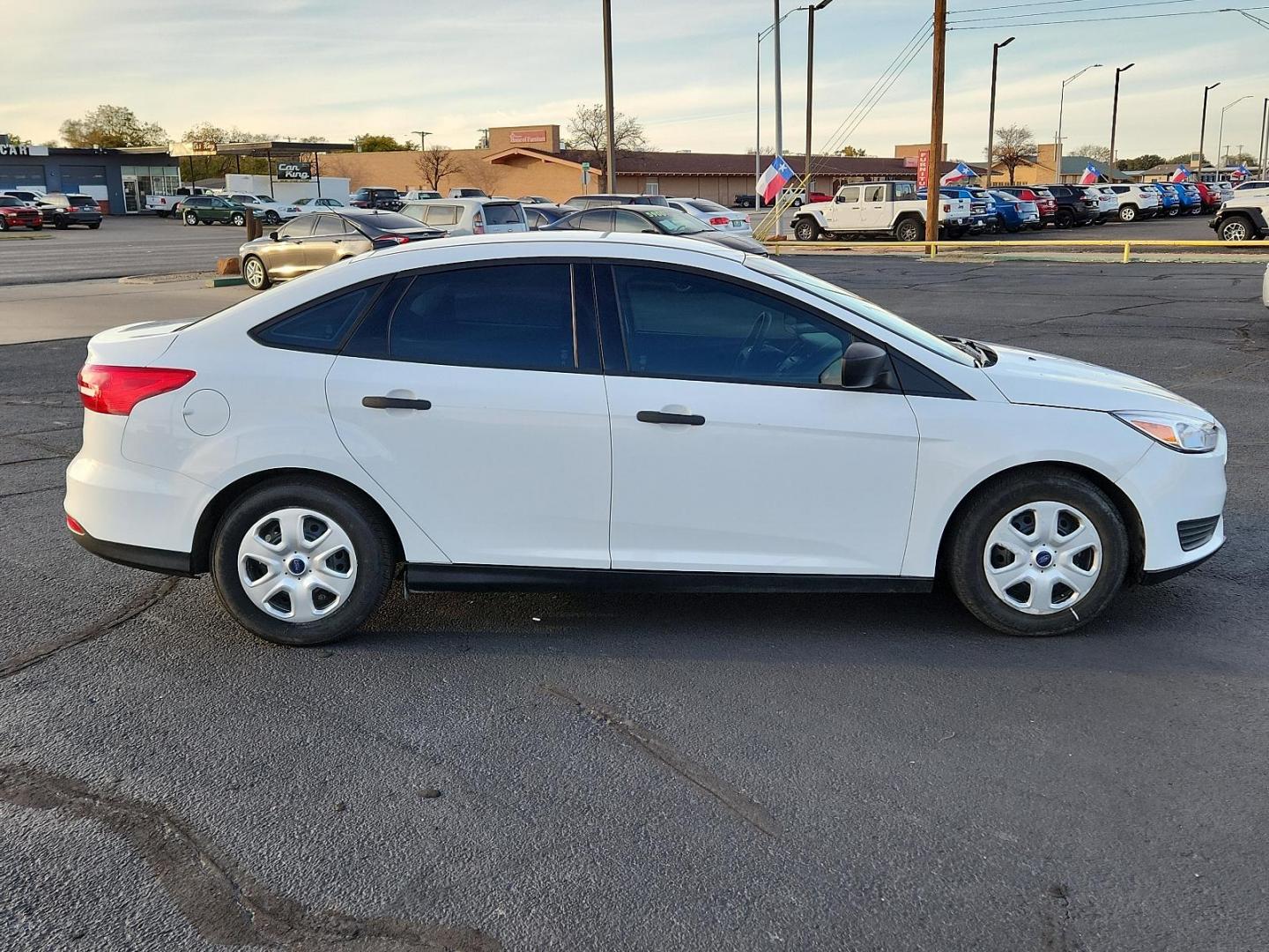 2017 Oxford White - YZ /Charcoal Black - YW Ford Focus S (1FADP3E20HL) with an ENGINE: 2.0L I-4 GDI TI-VCT FLEX FUEL engine, located at 4711 Ave Q, Lubbock, TX, 79412, (806) 687-2362, 33.551304, -101.855293 - Photo#2