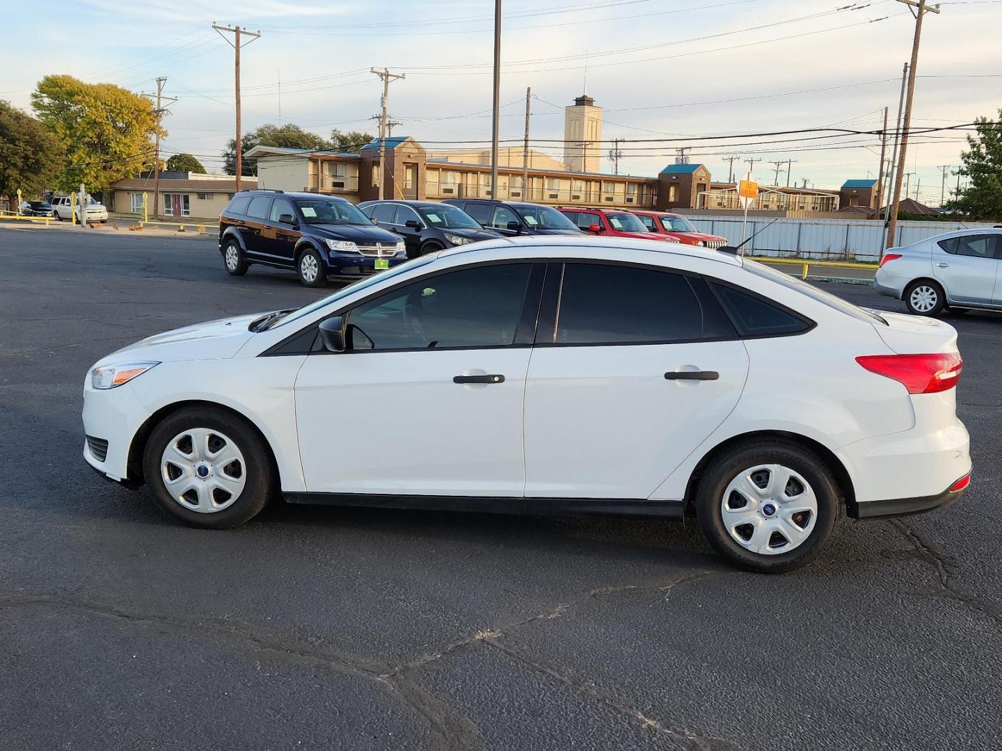 2017 Oxford White - YZ /Charcoal Black - YW Ford Focus S (1FADP3E20HL) with an ENGINE: 2.0L I-4 GDI TI-VCT FLEX FUEL engine, located at 4711 Ave Q, Lubbock, TX, 79412, (806) 687-2362, 33.551304, -101.855293 - Photo#5