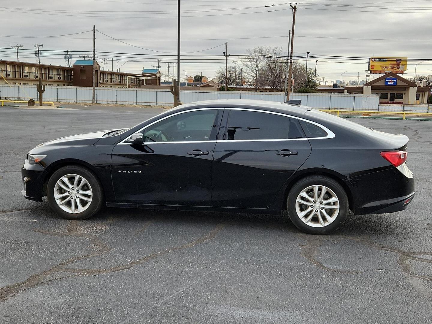 2016 BLACK Chevrolet Malibu LT (1G1ZE5STXGF) with an ENGINE, 1.5L TURBO DOHC 4-CYLINDER DI engine, located at 4711 Ave Q, Lubbock, TX, 79412, (806) 687-2362, 33.551304, -101.855293 - Photo#1