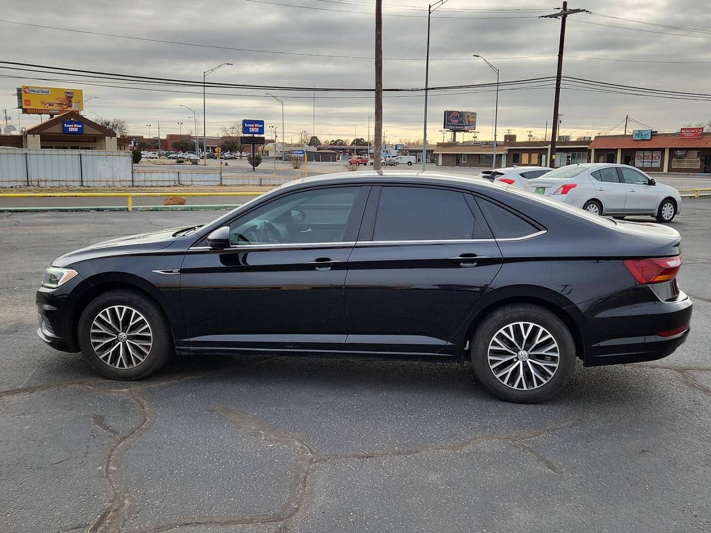 2019 BLACK Volkswagen Jetta SEL (3VWE57BUXKM) with an Engine: 1.4L TSI I-4 Turbocharged -inc: DOHC 16-valve, direct fuel injection engine, located at 4711 Ave Q, Lubbock, TX, 79412, (806) 687-2362, 33.551304, -101.855293 - Photo#1