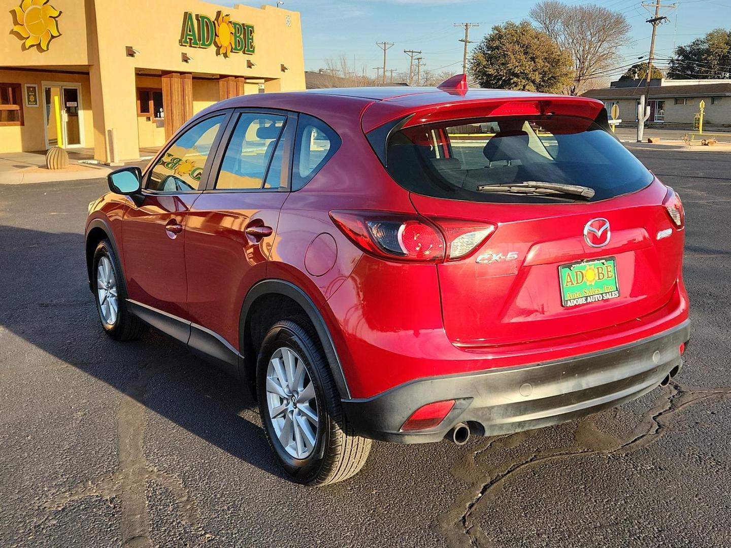 2016 RED Mazda CX-5 Sport (JM3KE2BY4G0) with an Engine: 2.5L SKYACTIV-G DOHC 16-Valve 4-Cylinder engine, located at 4711 Ave Q, Lubbock, TX, 79412, (806) 687-2362, 33.551304, -101.855293 - Photo#2