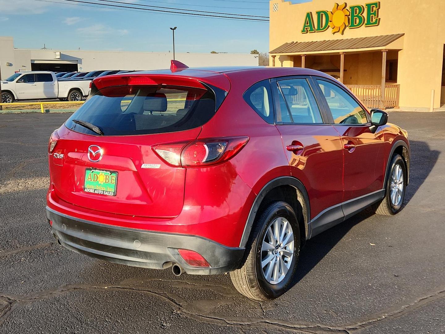 2016 RED Mazda CX-5 Sport (JM3KE2BY4G0) with an Engine: 2.5L SKYACTIV-G DOHC 16-Valve 4-Cylinder engine, located at 4711 Ave Q, Lubbock, TX, 79412, (806) 687-2362, 33.551304, -101.855293 - Photo#3