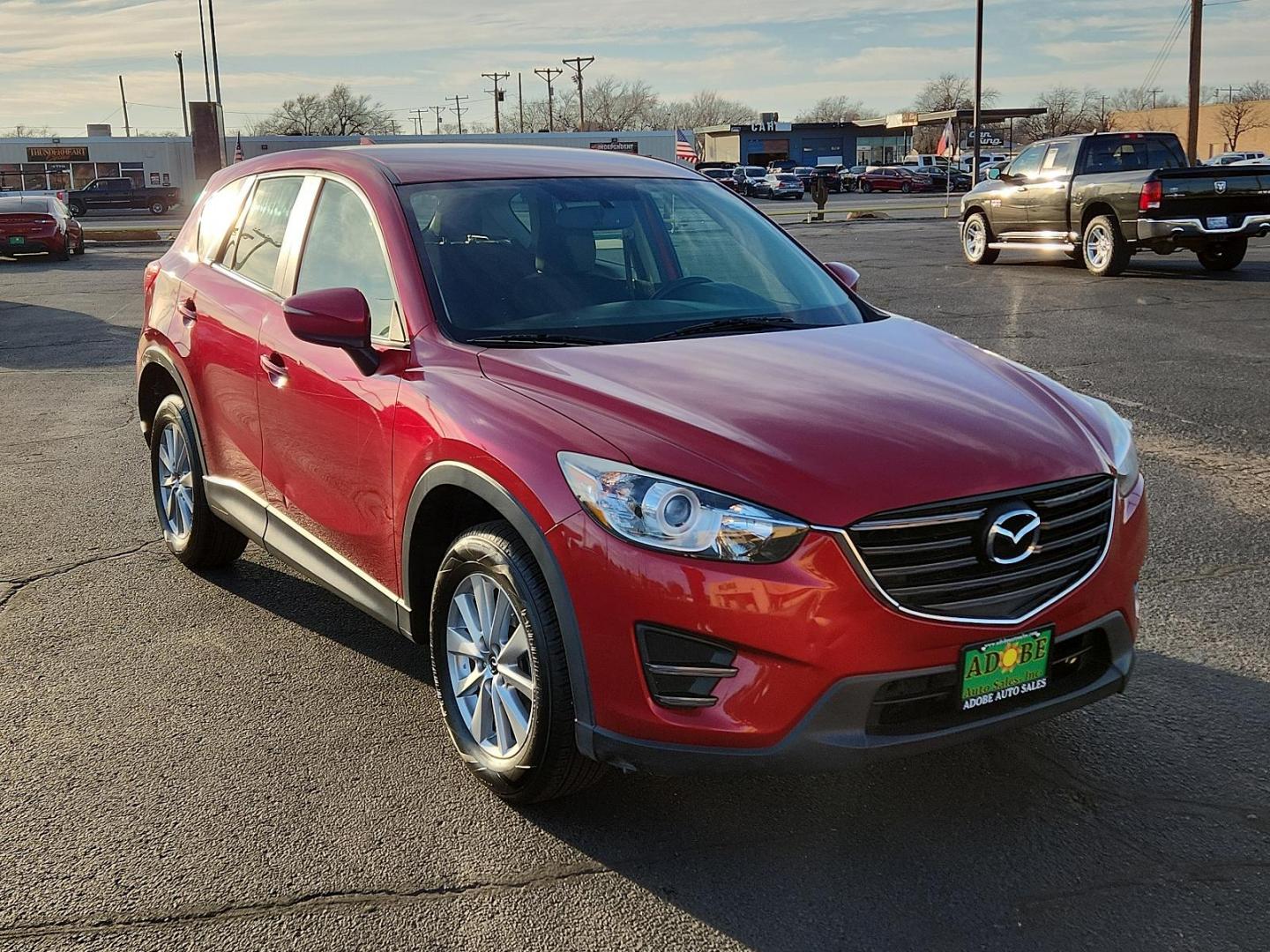 2016 RED Mazda CX-5 Sport (JM3KE2BY4G0) with an Engine: 2.5L SKYACTIV-G DOHC 16-Valve 4-Cylinder engine, located at 4711 Ave Q, Lubbock, TX, 79412, (806) 687-2362, 33.551304, -101.855293 - Photo#5