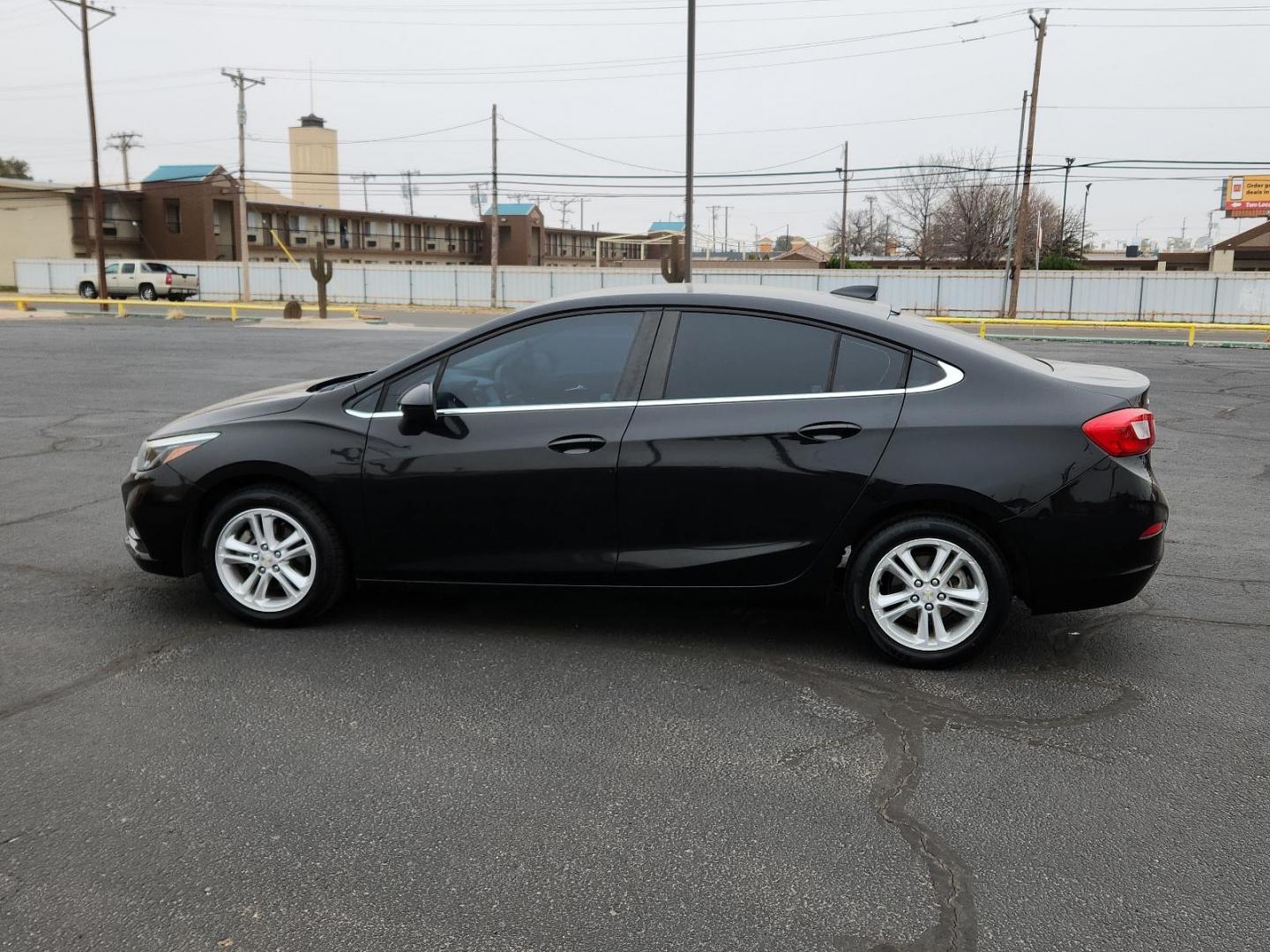 2016 BLACK Chevrolet Cruze LT (1G1BE5SM6G7) with an ENGINE, 1.4L TURBO DOHC 4-CYLINDER DI engine, located at 4711 Ave Q, Lubbock, TX, 79412, (806) 687-2362, 33.551304, -101.855293 - Photo#1