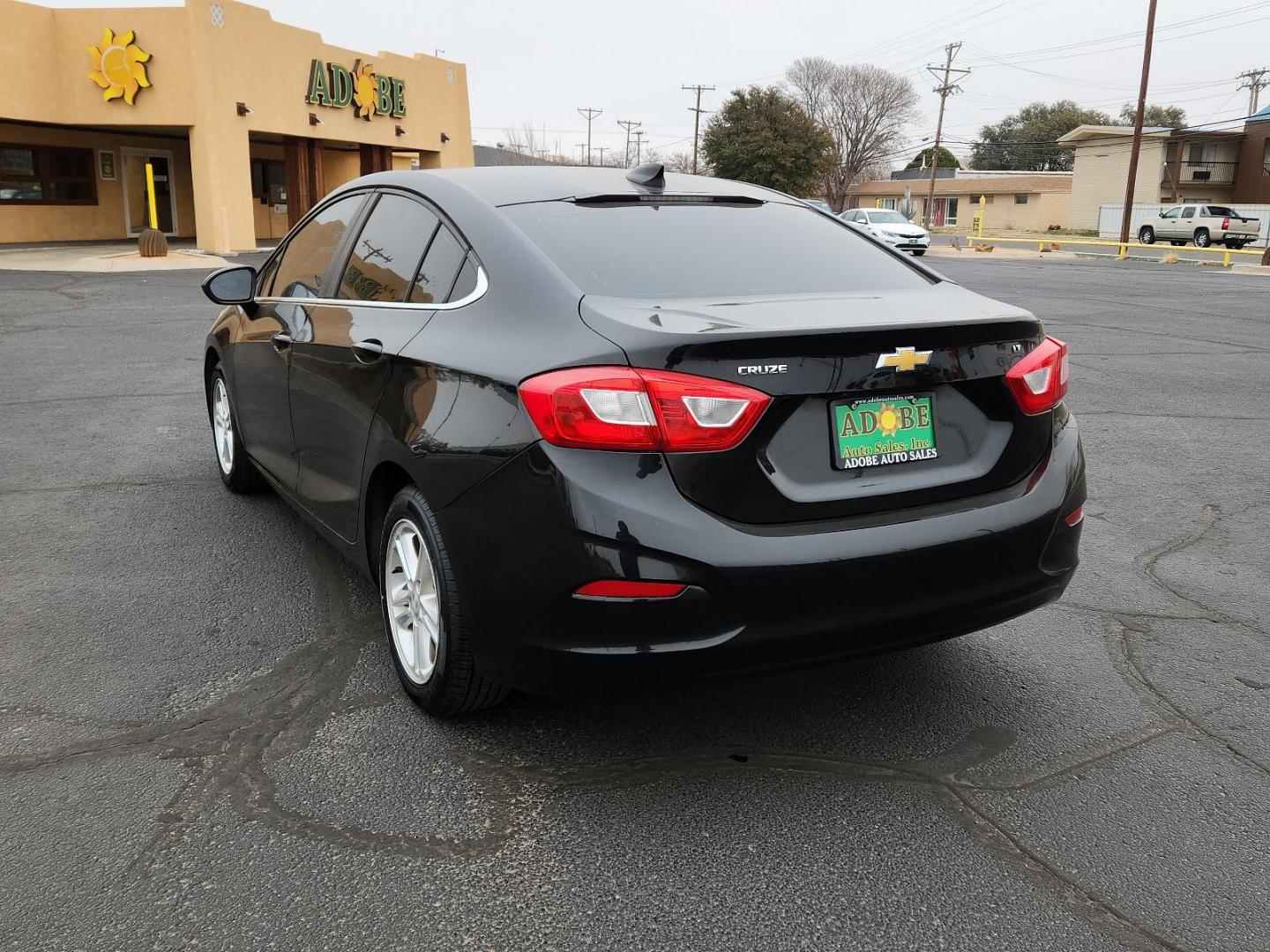 2016 BLACK Chevrolet Cruze LT (1G1BE5SM6G7) with an ENGINE, 1.4L TURBO DOHC 4-CYLINDER DI engine, located at 4711 Ave Q, Lubbock, TX, 79412, (806) 687-2362, 33.551304, -101.855293 - Photo#2