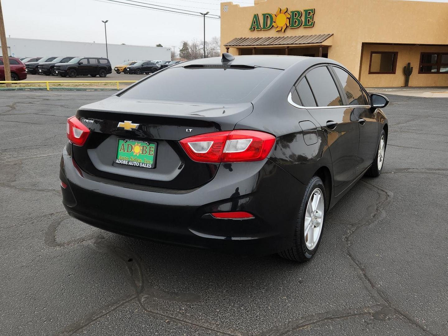 2016 BLACK Chevrolet Cruze LT (1G1BE5SM6G7) with an ENGINE, 1.4L TURBO DOHC 4-CYLINDER DI engine, located at 4711 Ave Q, Lubbock, TX, 79412, (806) 687-2362, 33.551304, -101.855293 - Photo#3