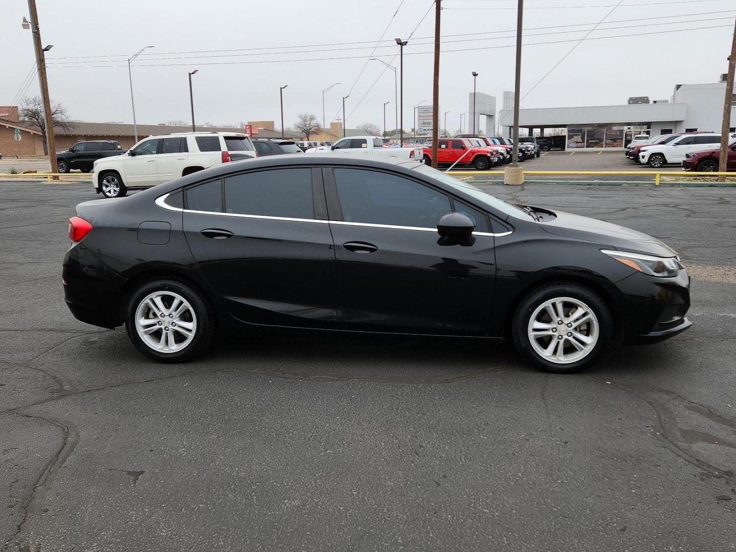 2016 BLACK Chevrolet Cruze LT (1G1BE5SM6G7) with an ENGINE, 1.4L TURBO DOHC 4-CYLINDER DI engine, located at 4711 Ave Q, Lubbock, TX, 79412, (806) 687-2362, 33.551304, -101.855293 - Photo#4