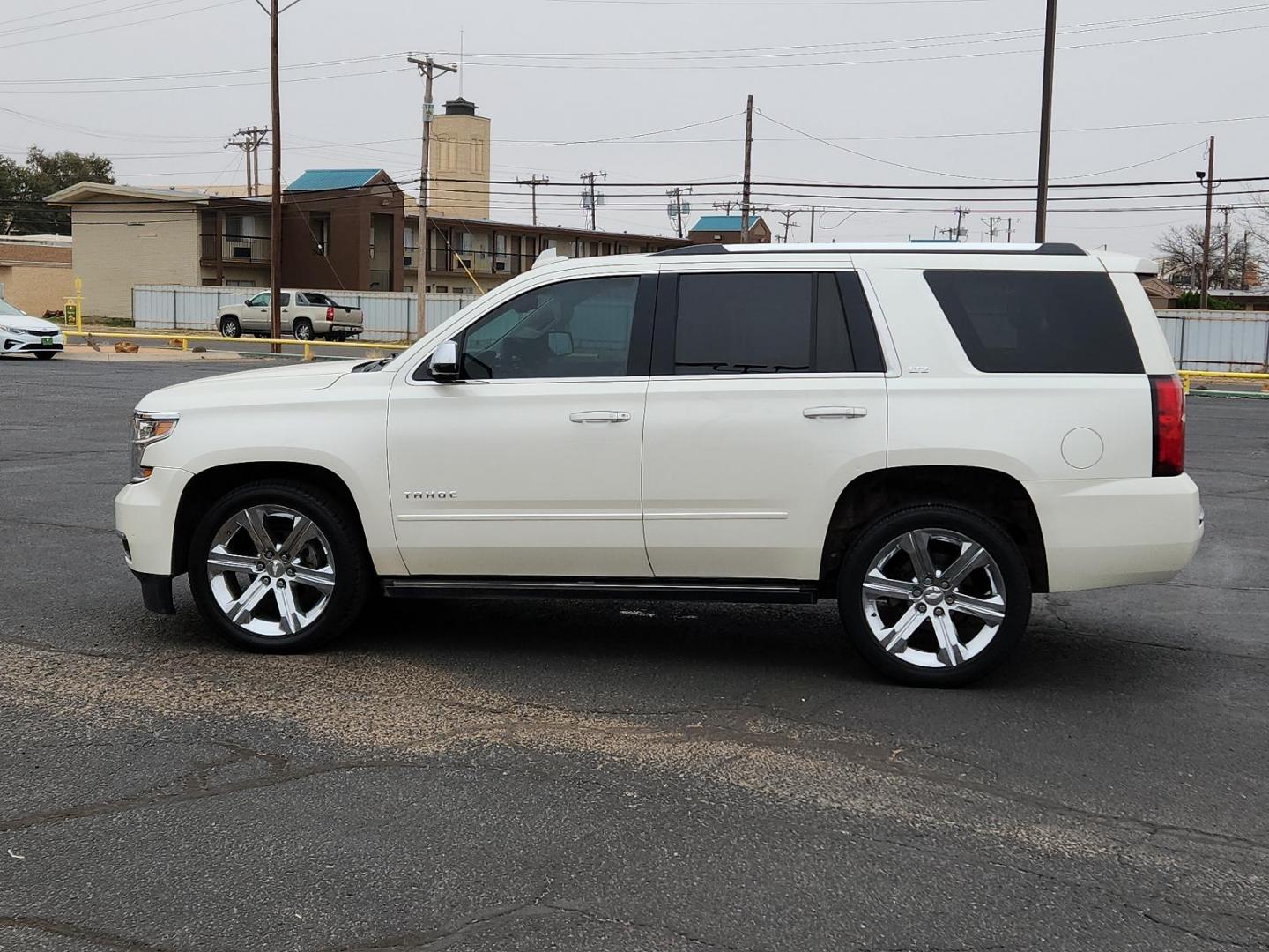 2015 WHITE Chevrolet Tahoe LTZ (1GNSCCKCXFR) with an ENGINE, 5.3L ECOTEC3 V8 WITH ACTIVE FUEL MANAGEMENT, DIRECT INJECTION AND VARIABLE VALVE TIMING engine, located at 4711 Ave Q, Lubbock, TX, 79412, (806) 687-2362, 33.551304, -101.855293 - Photo#1