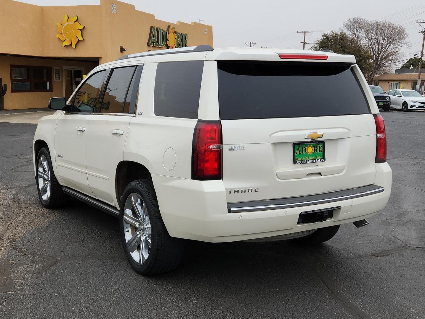 2015 WHITE Chevrolet Tahoe LTZ (1GNSCCKCXFR) with an ENGINE, 5.3L ECOTEC3 V8 WITH ACTIVE FUEL MANAGEMENT, DIRECT INJECTION AND VARIABLE VALVE TIMING engine, located at 4711 Ave Q, Lubbock, TX, 79412, (806) 687-2362, 33.551304, -101.855293 - Photo#2