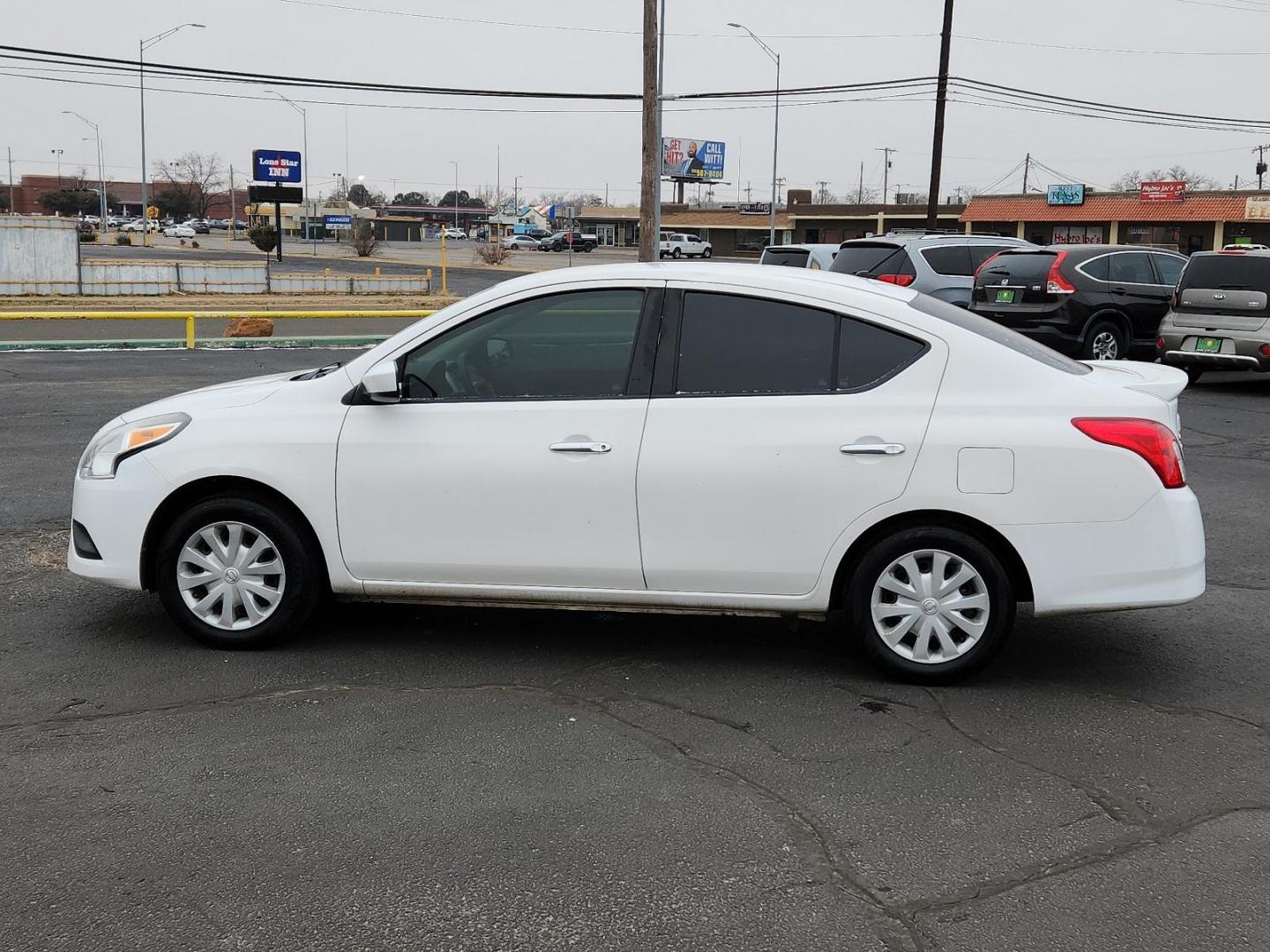 2017 WHITE Nissan Versa Sedan SV (3N1CN7AP7HL) with an Engine: 1.6L DOHC 16 Valve 4-Cylinder engine, located at 4711 Ave Q, Lubbock, TX, 79412, (806) 687-2362, 33.551304, -101.855293 - Photo#1