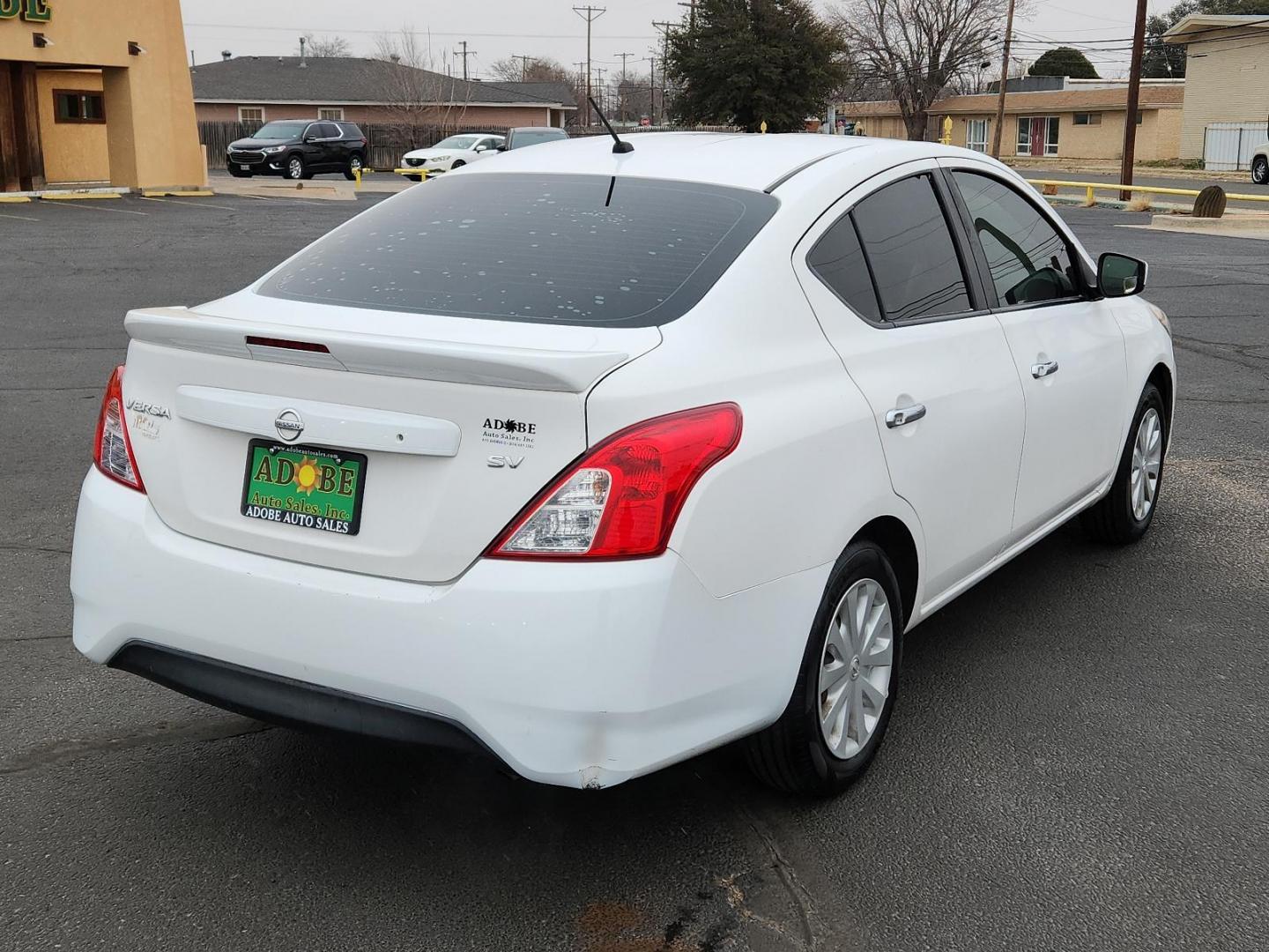 2017 WHITE Nissan Versa Sedan SV (3N1CN7AP7HL) with an Engine: 1.6L DOHC 16 Valve 4-Cylinder engine, located at 4711 Ave Q, Lubbock, TX, 79412, (806) 687-2362, 33.551304, -101.855293 - Photo#3